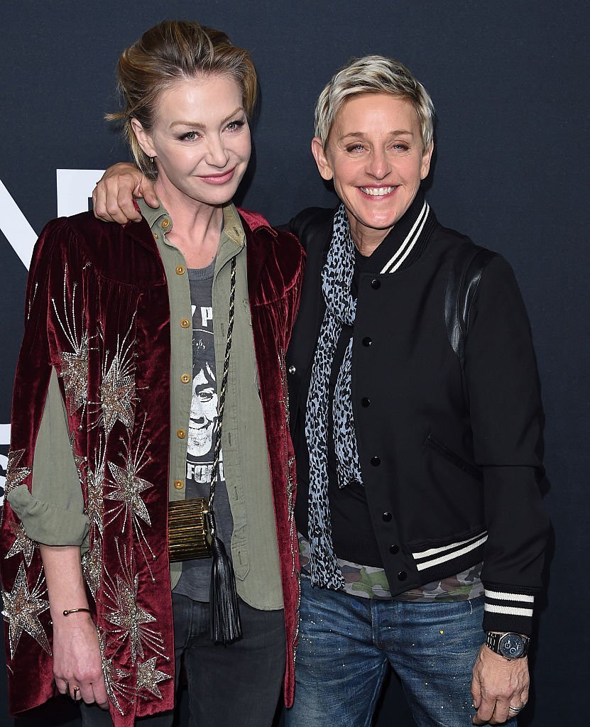 Actress Portia de Rossi and comedian Ellen DeGeneres arrive at SAINT LAURENT At The Palladium | Getty Images