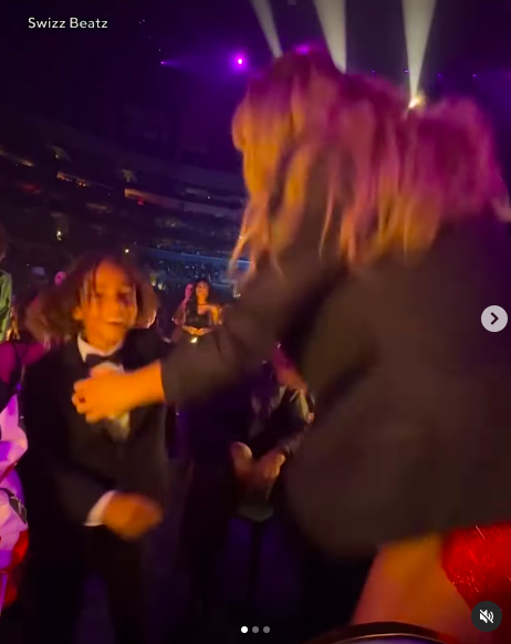 Genesis Dean smiling as he dances with Taylor Swift at the Grammys. | Source: Instagram/entertainmenttonight