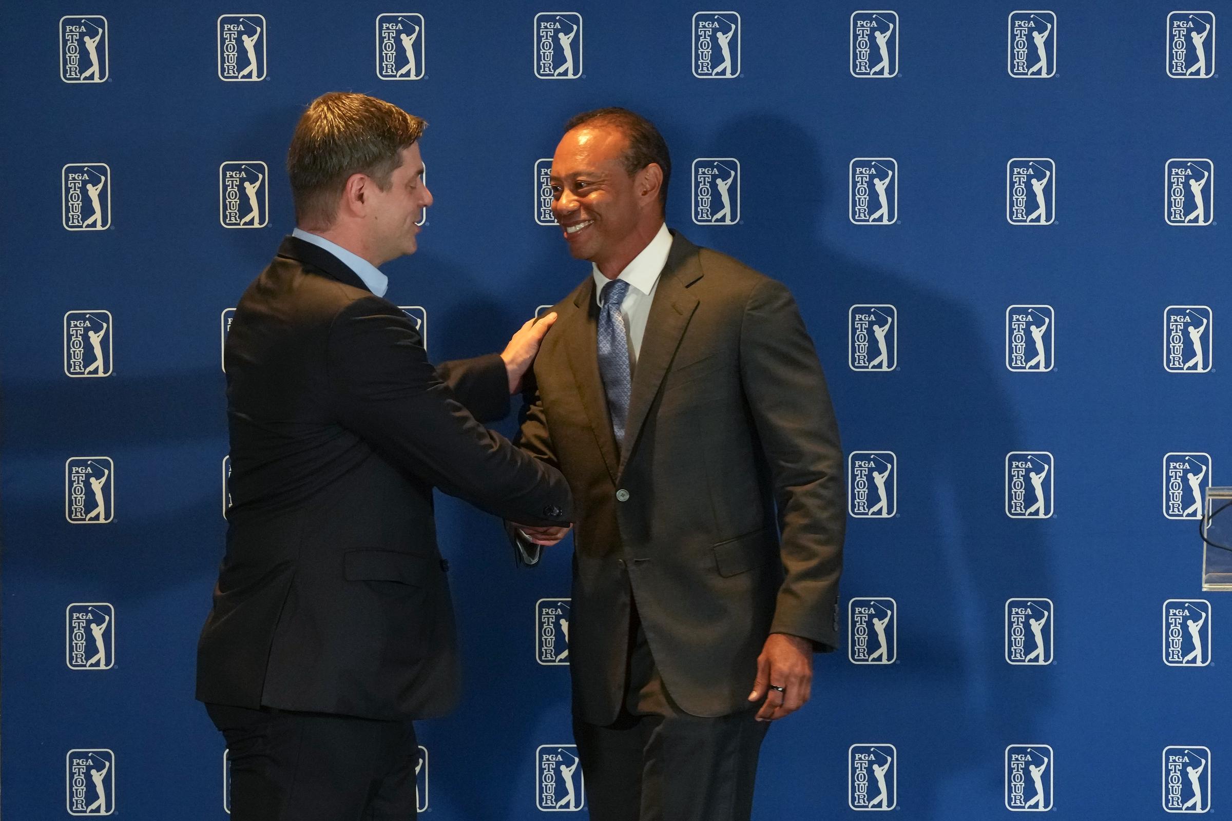 Netizens reacted to this appearance immediately, and their comments were surprisingly uplifting. At this event, Tiger Woods shook hands with Brian Rolapp, CEO of the PGA TOUR, during an announcement of a new competitive model to the tour prior to the Travelers Championship at TPC River Highlands on June 23, 2026, in Cromwell, Connecticut. | Source: Getty Images