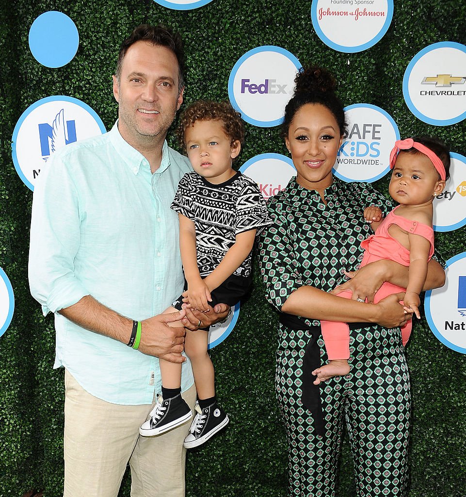Adam Housley, Aden Housley, Tamera Mowry and Ariah Housley arrive at the Safe Kids Day event on April 24, 2016, in Culver City, California | Source: Getty Images (Photo by Jason LaVeris/FilmMagic)