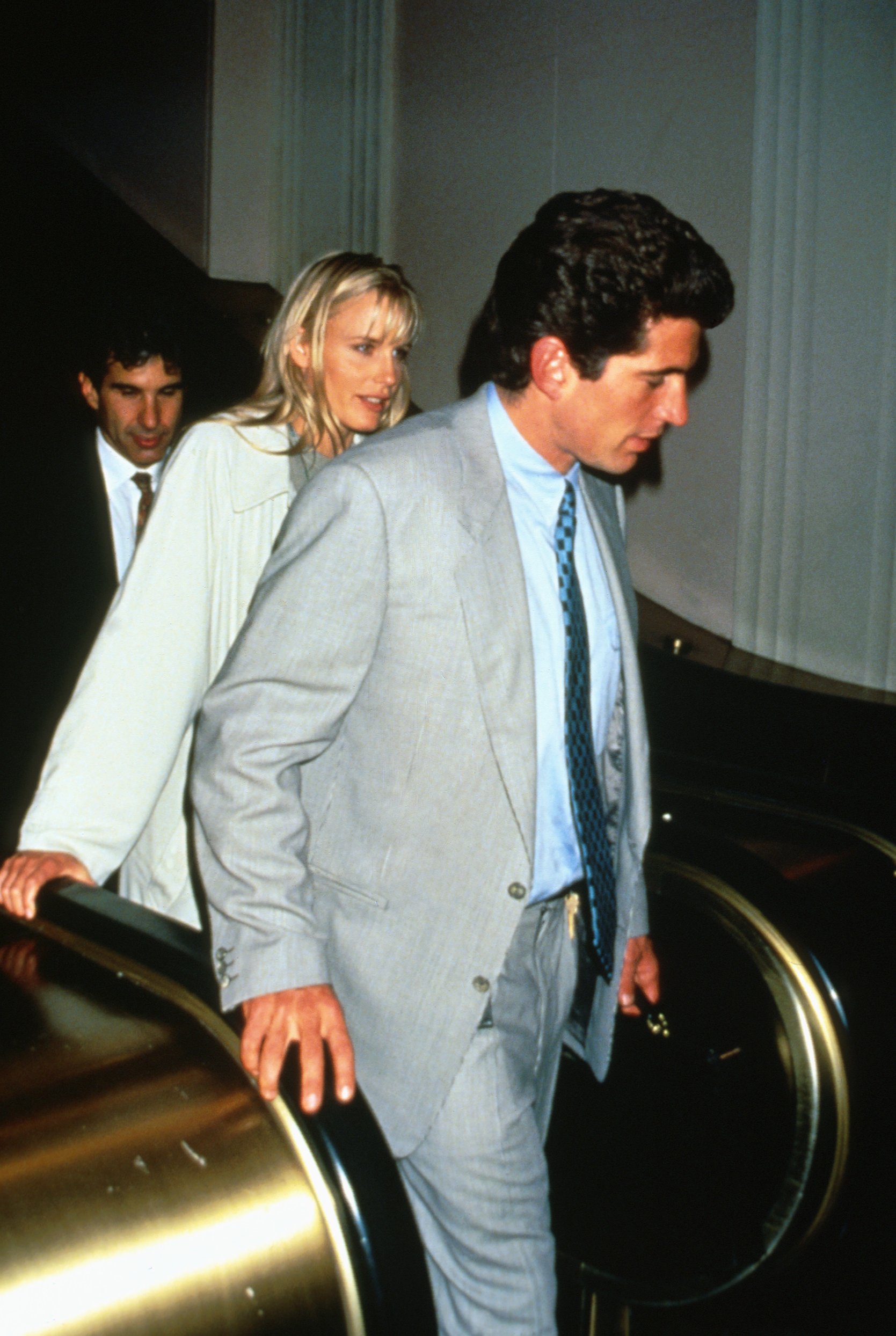 Magazine publisher and journalist John F. Kennedy Jr. photographed walking with girlfriend Daryl Hannah. / Source: Getty Images