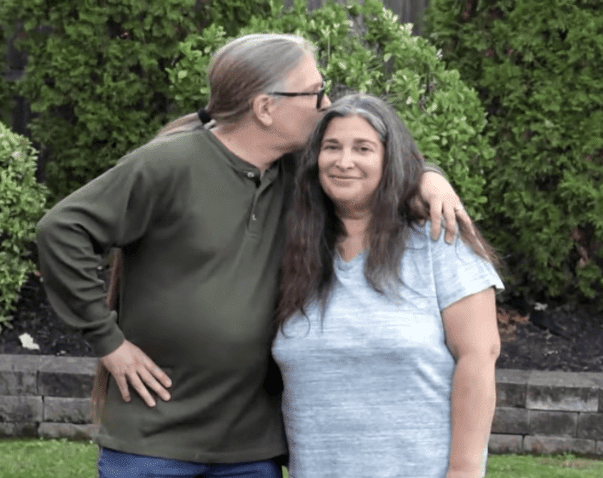 Charles plants a kiss on his wife's head. | Source: YouTube/RachaelRayShow