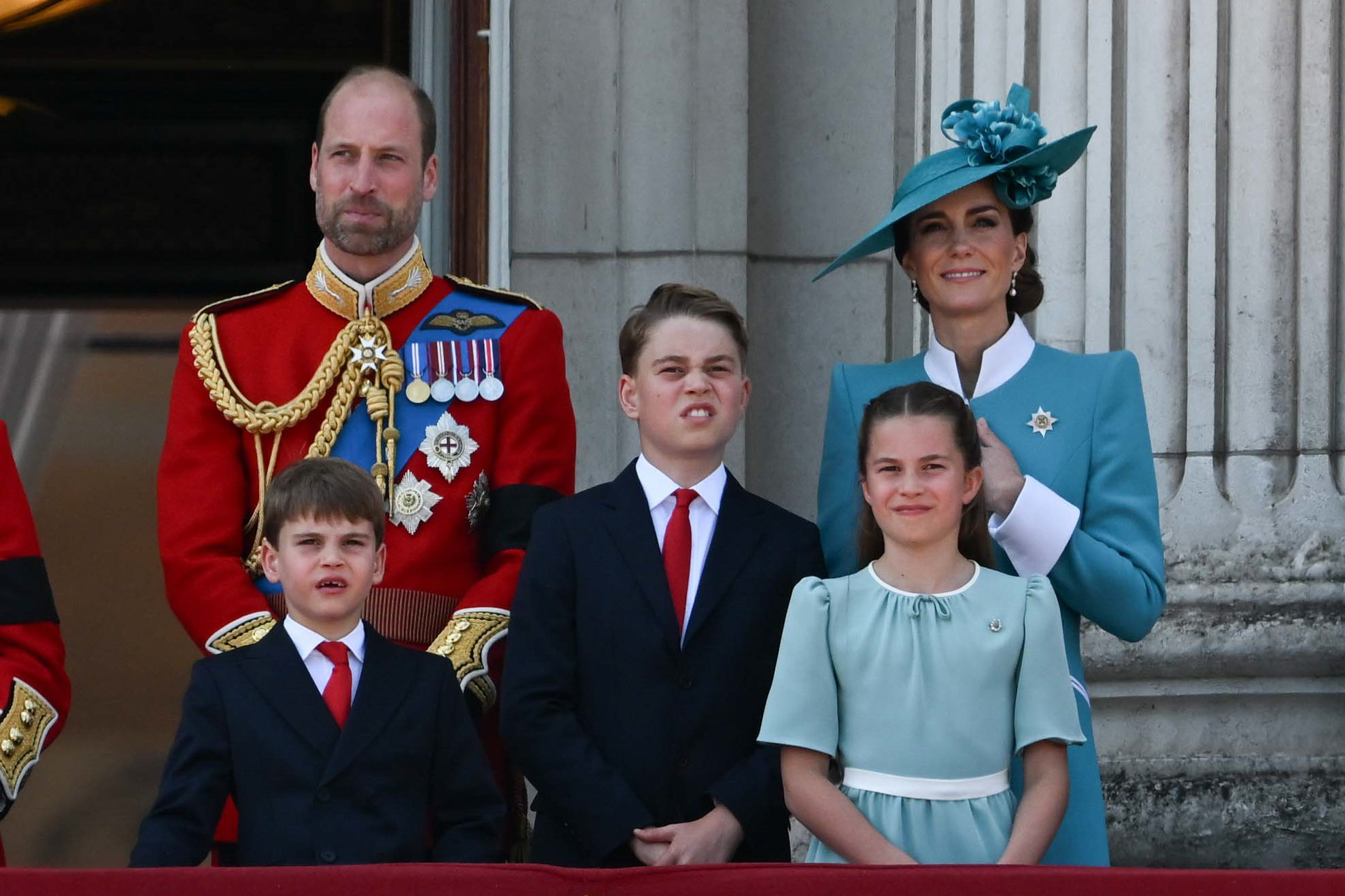 Prince William, Prince Louis, Prince George, Princess Catherine, and Princess Charlotte watching the festivities from the balcony. | Source: Getty Images