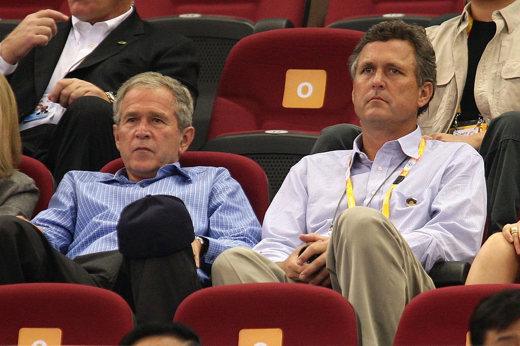 George W. Bush and brother Marvin Bush watch the women's preliminary basketball game between the United States and Czech Republic on August 9, 2008. | Photo: Getty Images