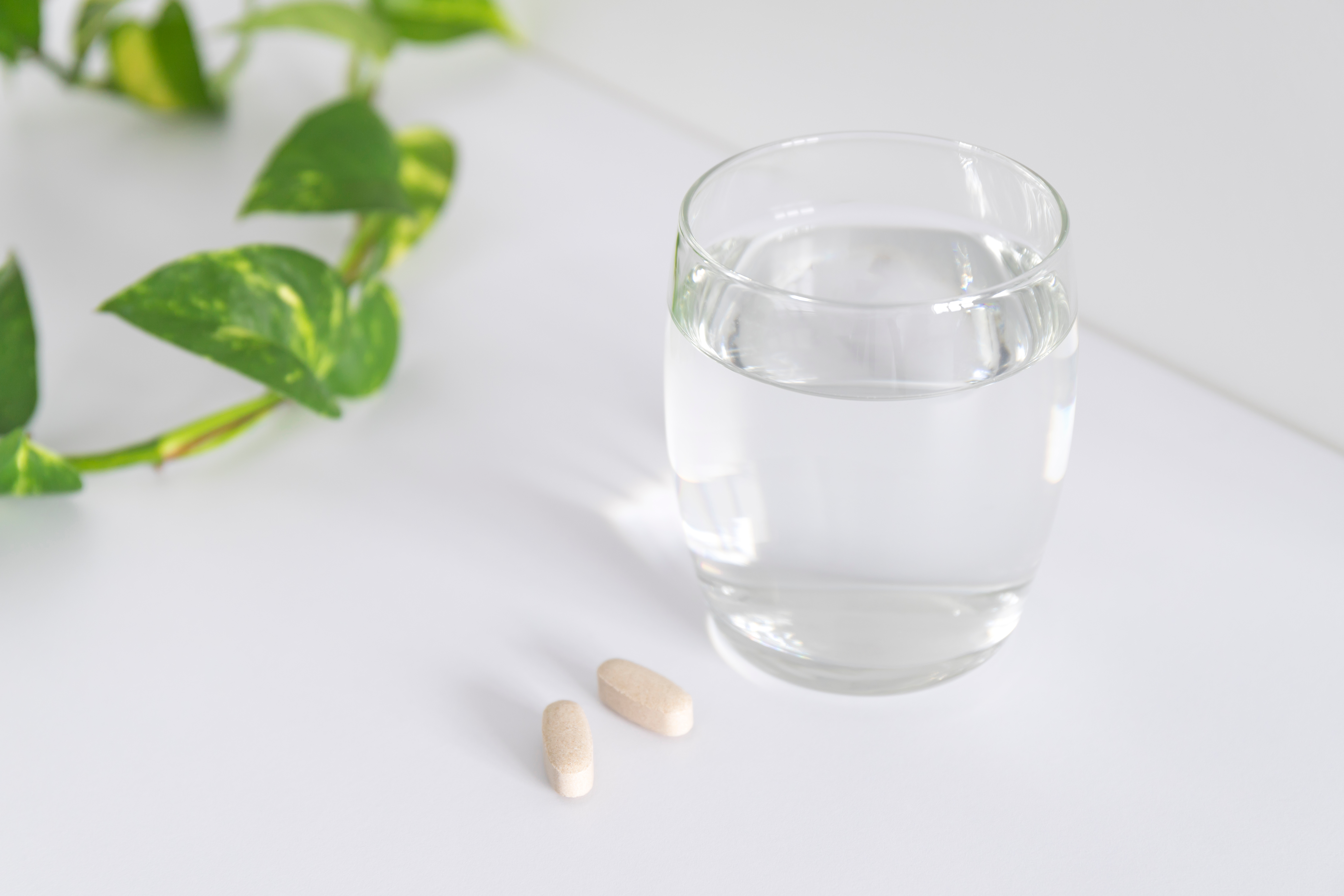 Pills and glass of water. | Source: Shutterstock