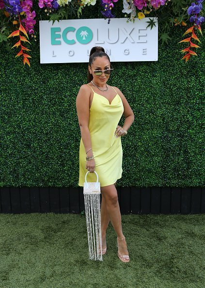 Adrienne Bailon-Houghton attends Debbie Durkin's EcoLuxe Lounge TV Awards at The Beverly Hilton Hotel | Photo: Getty Images
