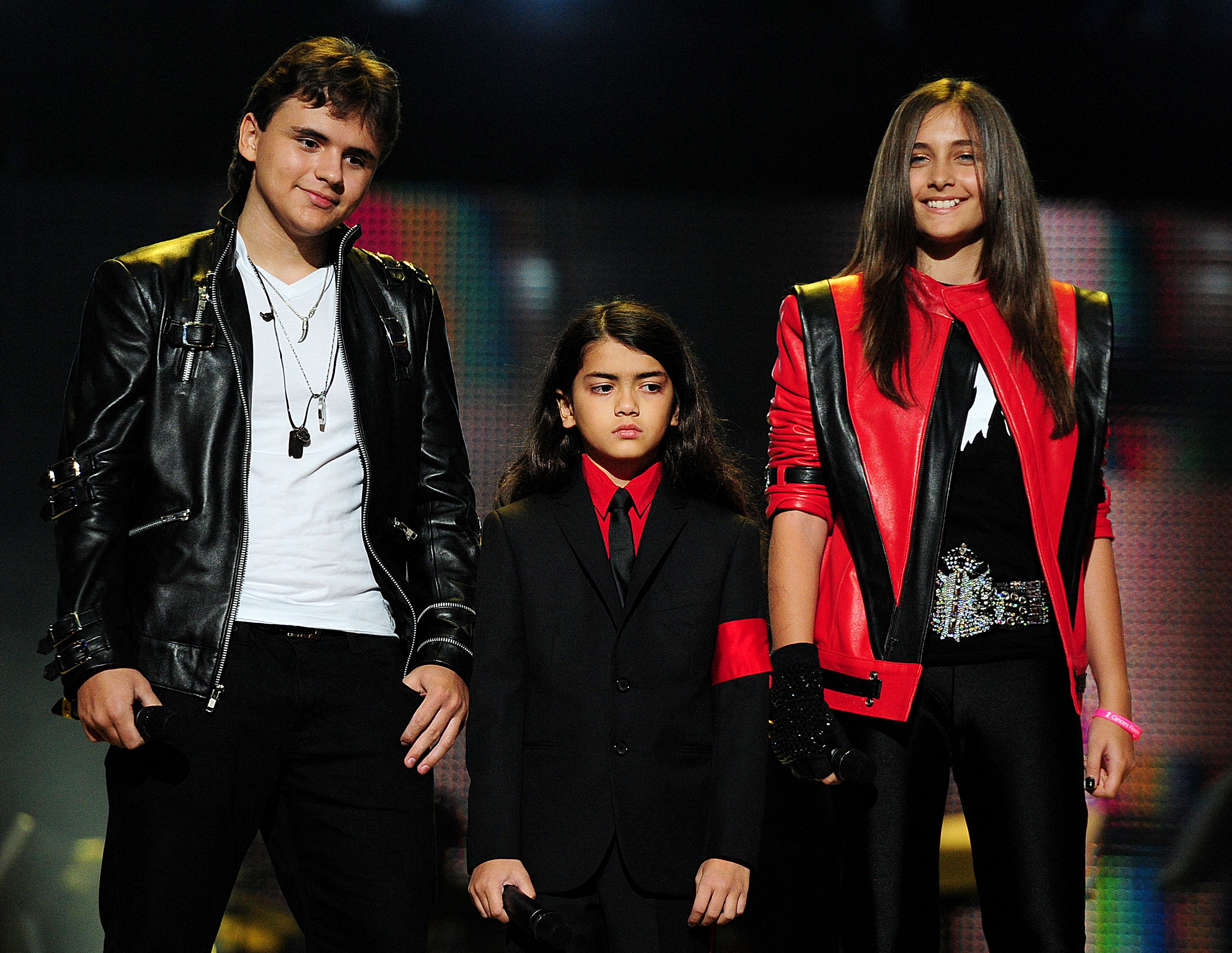 Prince, Blanket, and Paris Jackson on stage during the "Michael Forever" concert in memory of the late Michael Jackson in Cardiff, Wales, on October 8, 2011 | Source: Getty Images