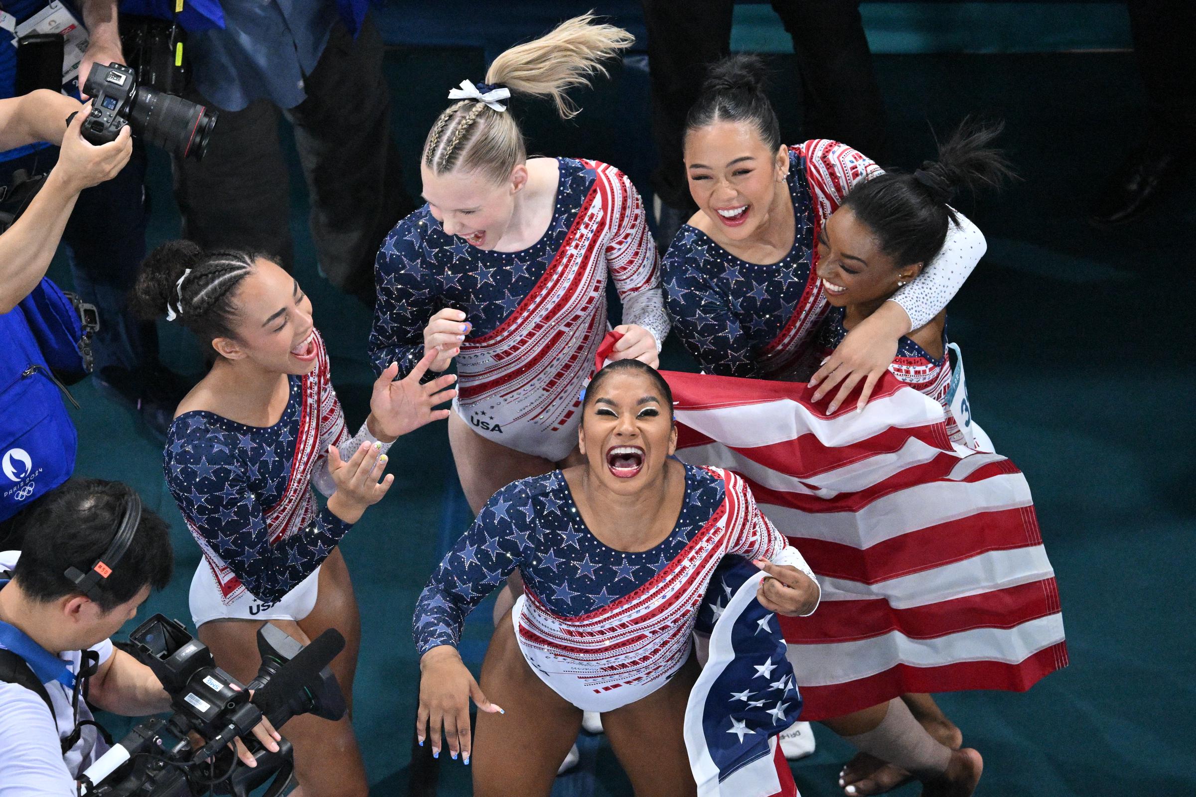 (R) Simone Biles, Sunisa Lee (L), Jordan Chiles (front) and Jade Carey (back) and Hezly Rivera celebrate after winning the artistic gymnastics women's team final on July 30, 2024, in Paris, France. | Source: Getty Images