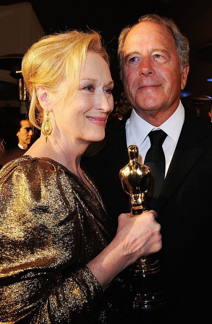Meryl Streep holding her Oscar Award with her husband Don Gummer at the 84th Academy Awards in February 2012 in Hollywood, California. | Photo: Getty Images