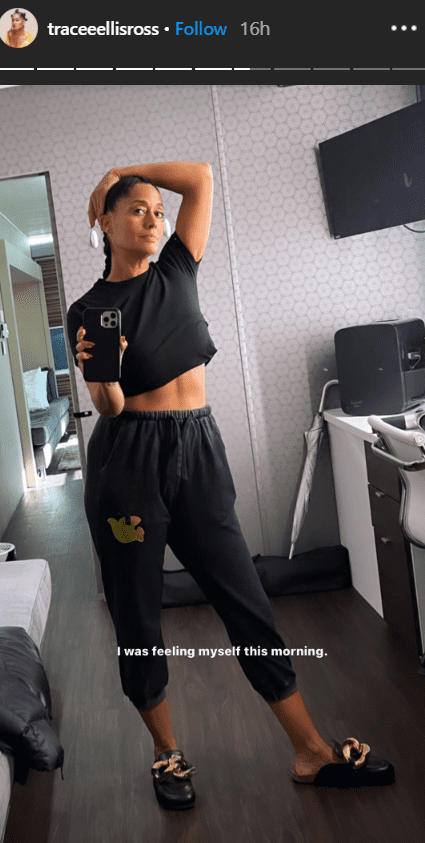 Tracee Ellis in a mirror selfie wearing a black crop top and sweat pants. | Photo: Instagram/traceeellisross