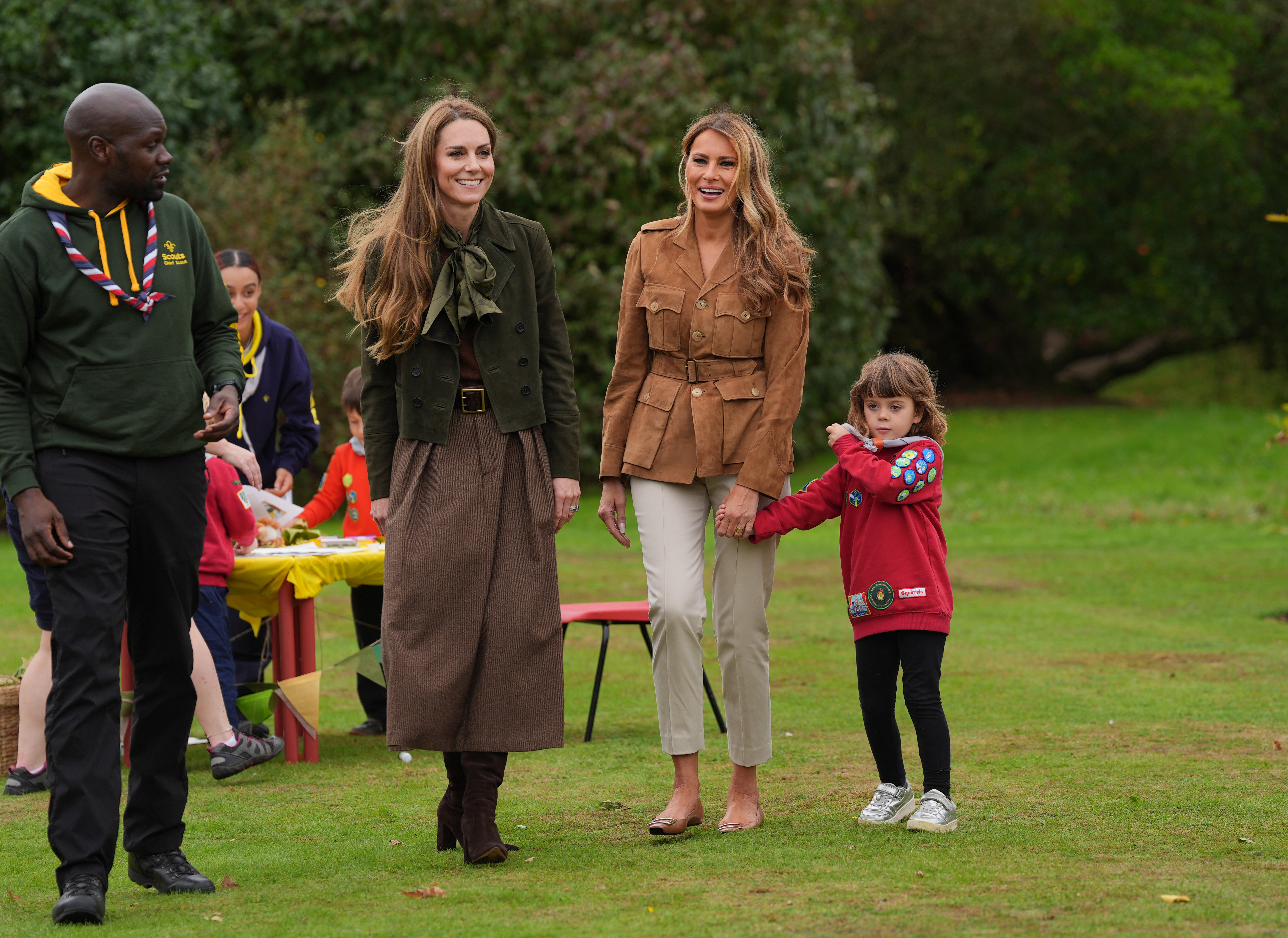 Princess Kate and First Lady Melania Trump walk with the Chief Scout for the Scout Association, Dwayne Fields, on September 18, 2025 | Source: Getty Images