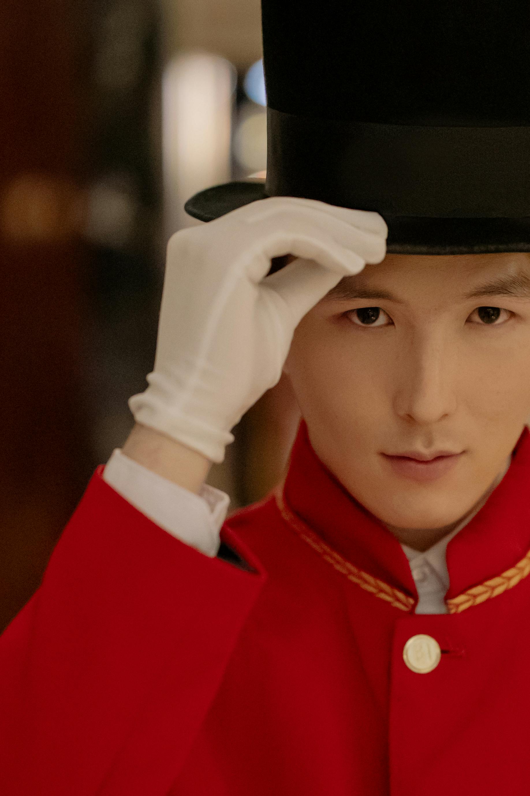 A doorman tilting his hat in respect | Source: Pexels