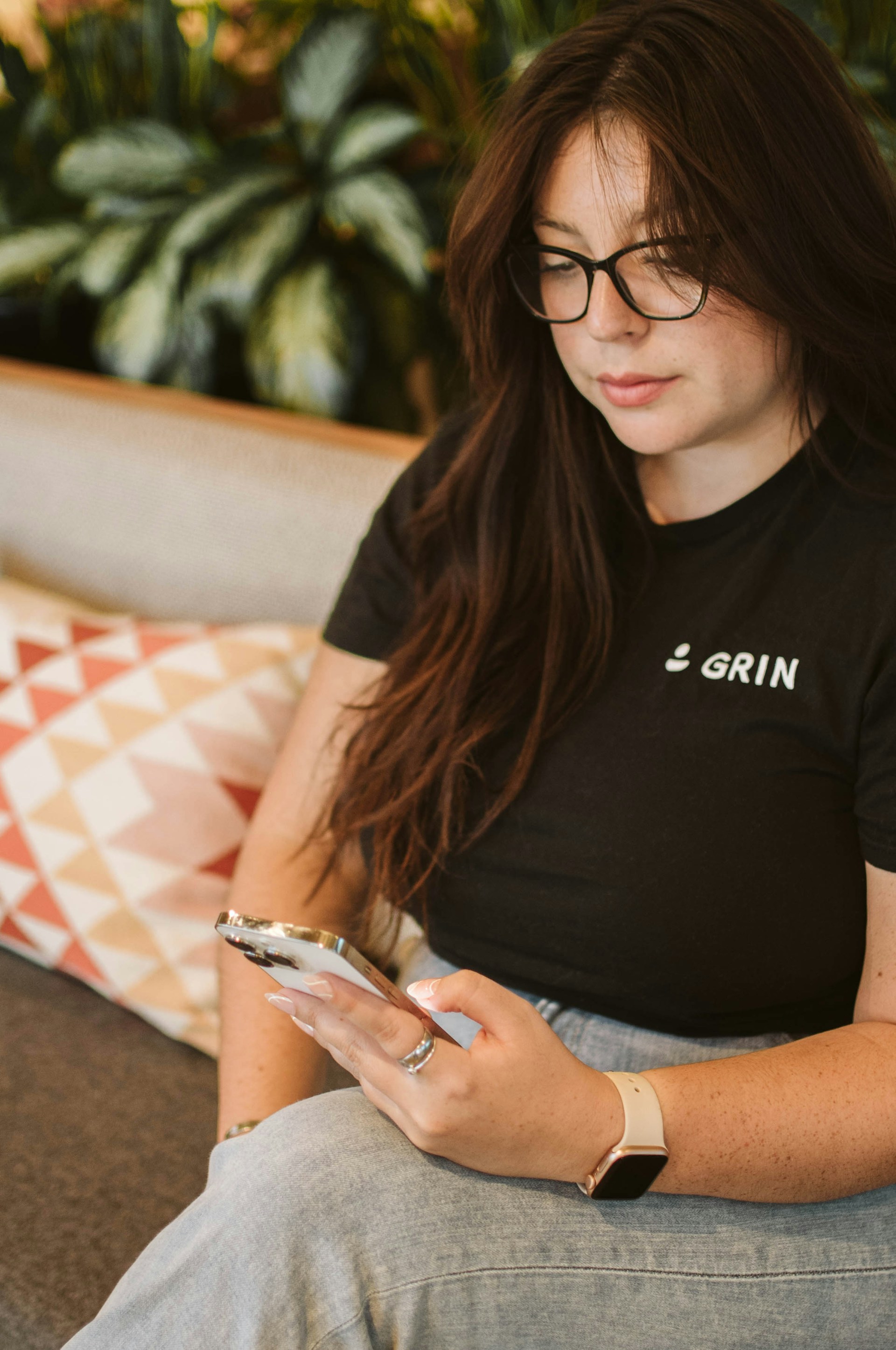 A woman sitting on a couch | Source: Unsplash