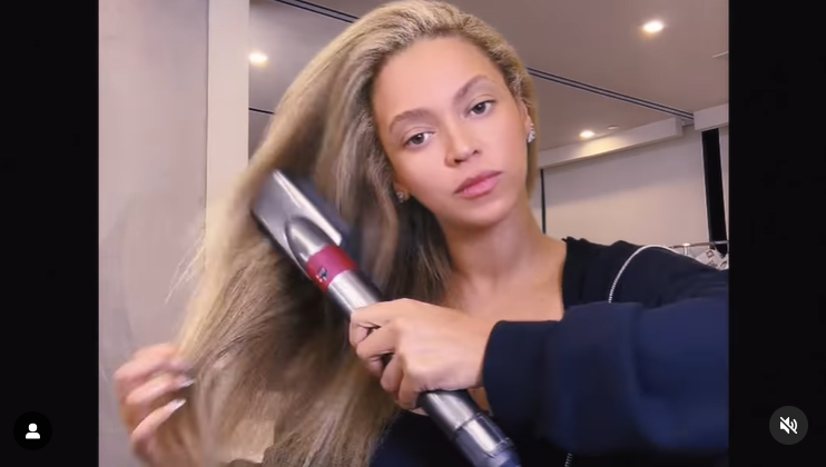 Beyoncé straightens her blonde hair in a video shared in April 2024. | Source: Instagram/beyonce
