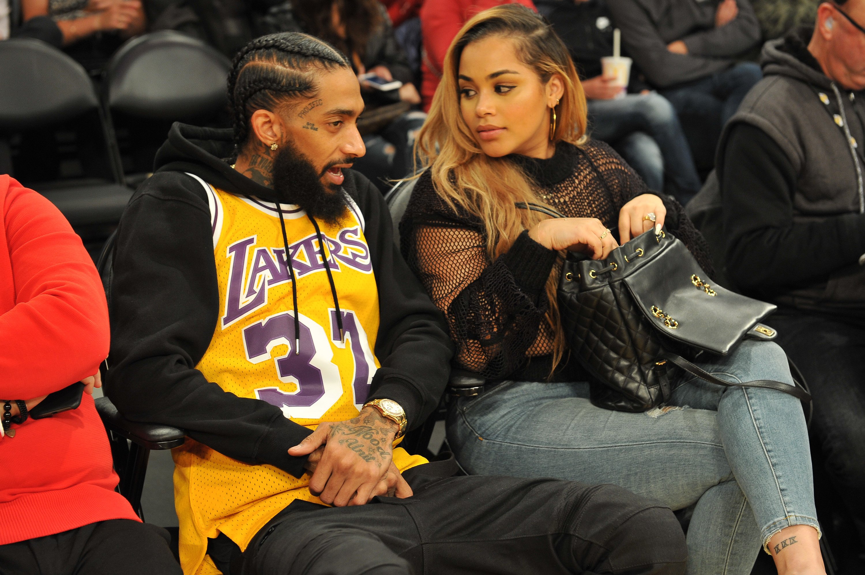 Nipsey Hussle and Lauren London at a basketball game between the Los Angeles Lakers and the Minnesota Timberwolves on December 25, 2017, in Los Angeles, California. | Source: Getty Images