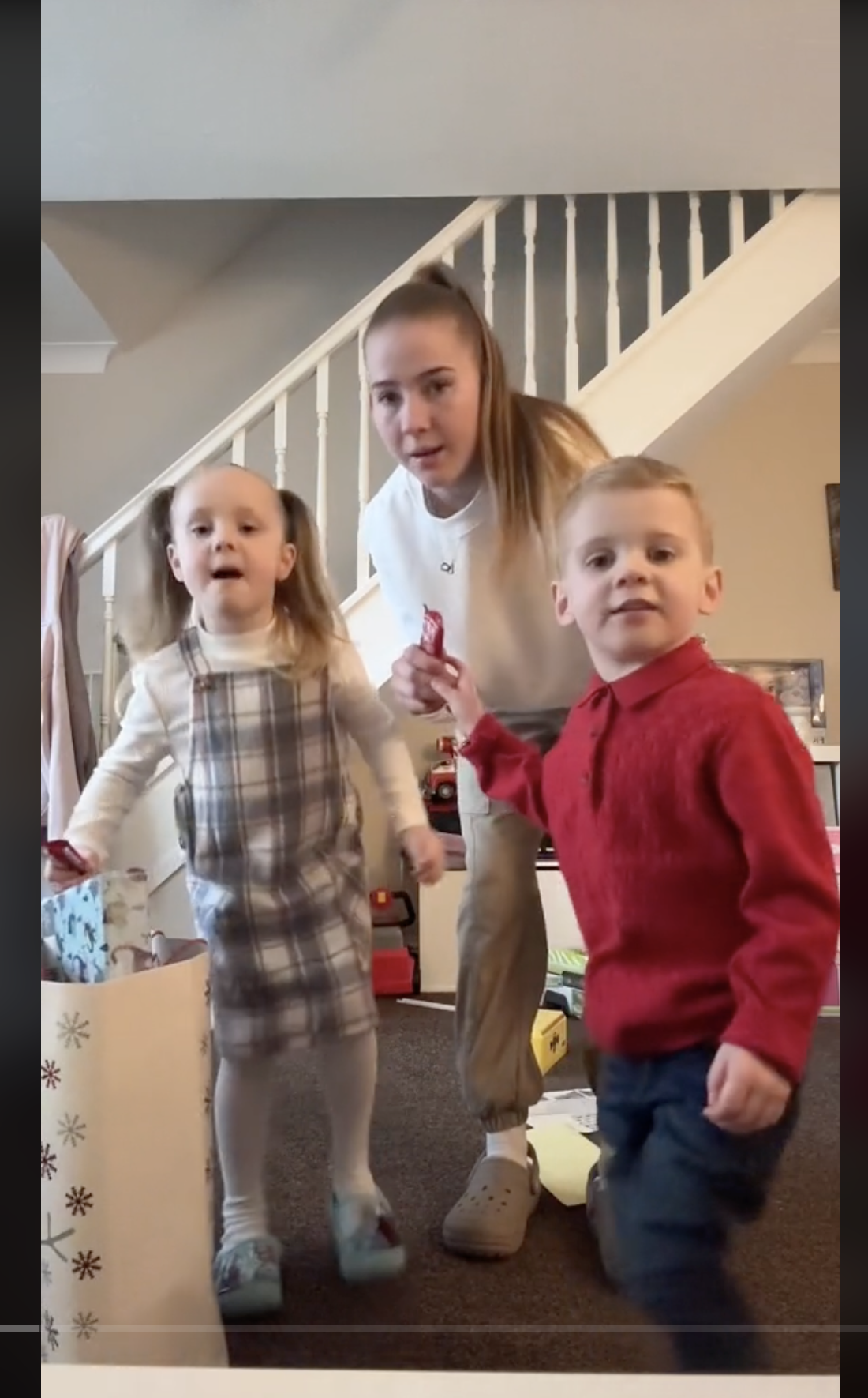 Georgia Schofield with her children, Ava and Leo, as seen in a video dated December 25, 2023 | Source: tiktok.com/@bruh.georgia