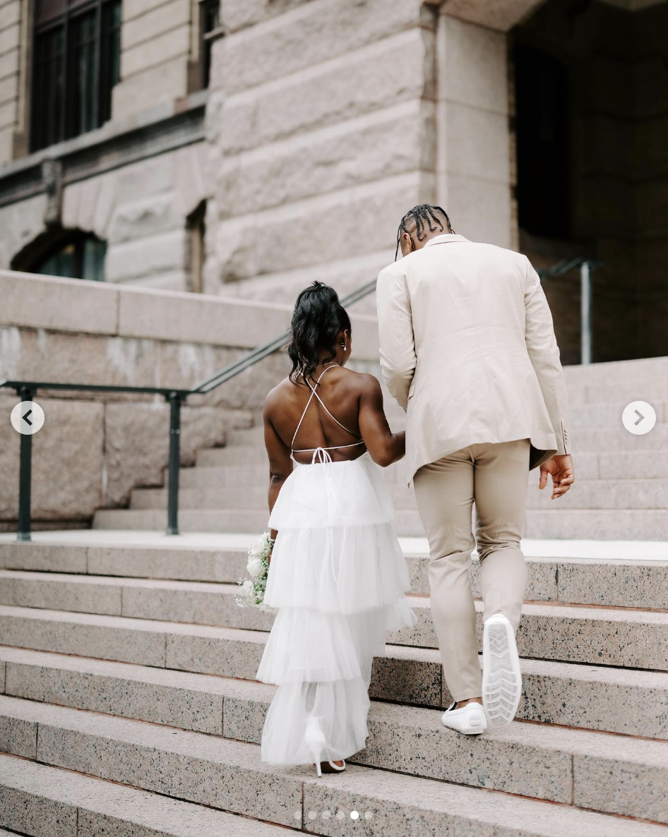 Jonathan Owens and Simone Biles ascending the courthouse steps on their wedding day, as seen in a post dated April 22, 2023 | Source: Instagram/simonebiles