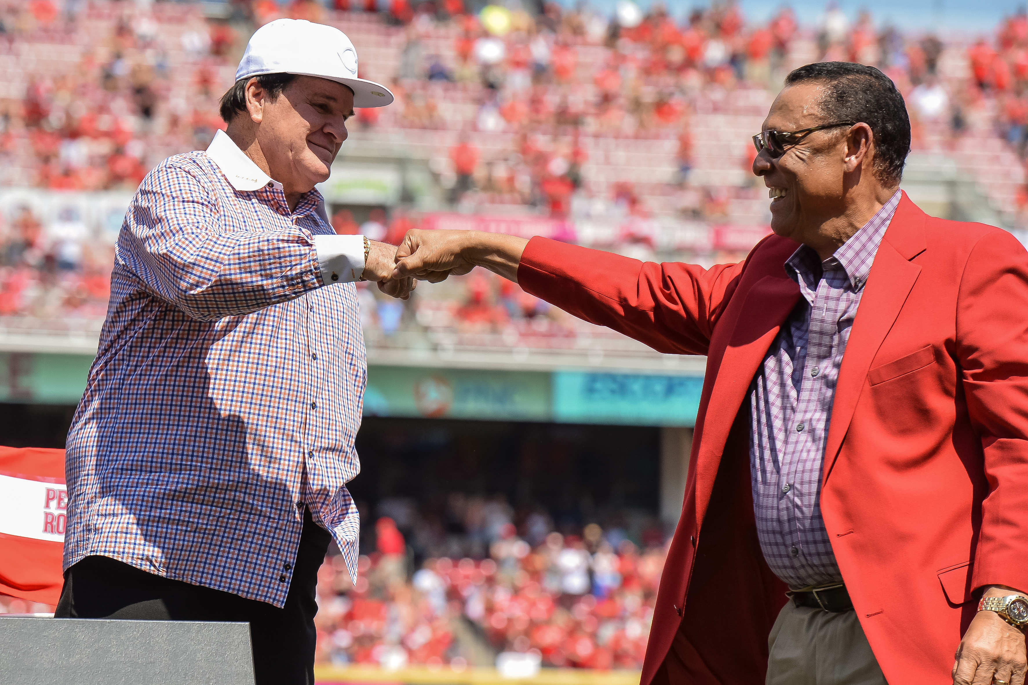 Pete Rose and Tony Pérez share a fist bump at Great American Ball Park in Cincinnati, Ohio, on June 25, 2016 | Source: Getty Images