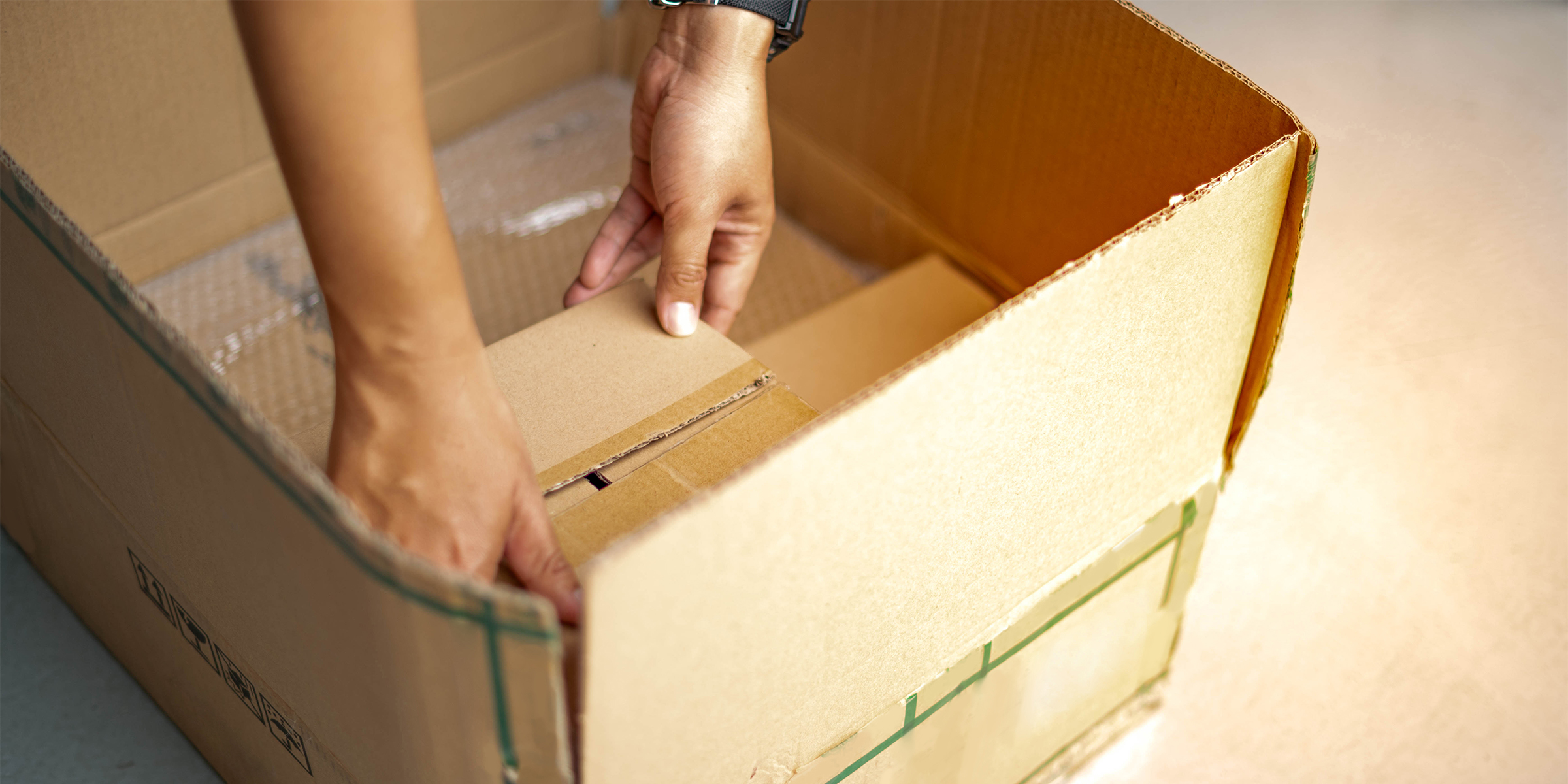 A woman with a cardboard box | Source: Shutterstock