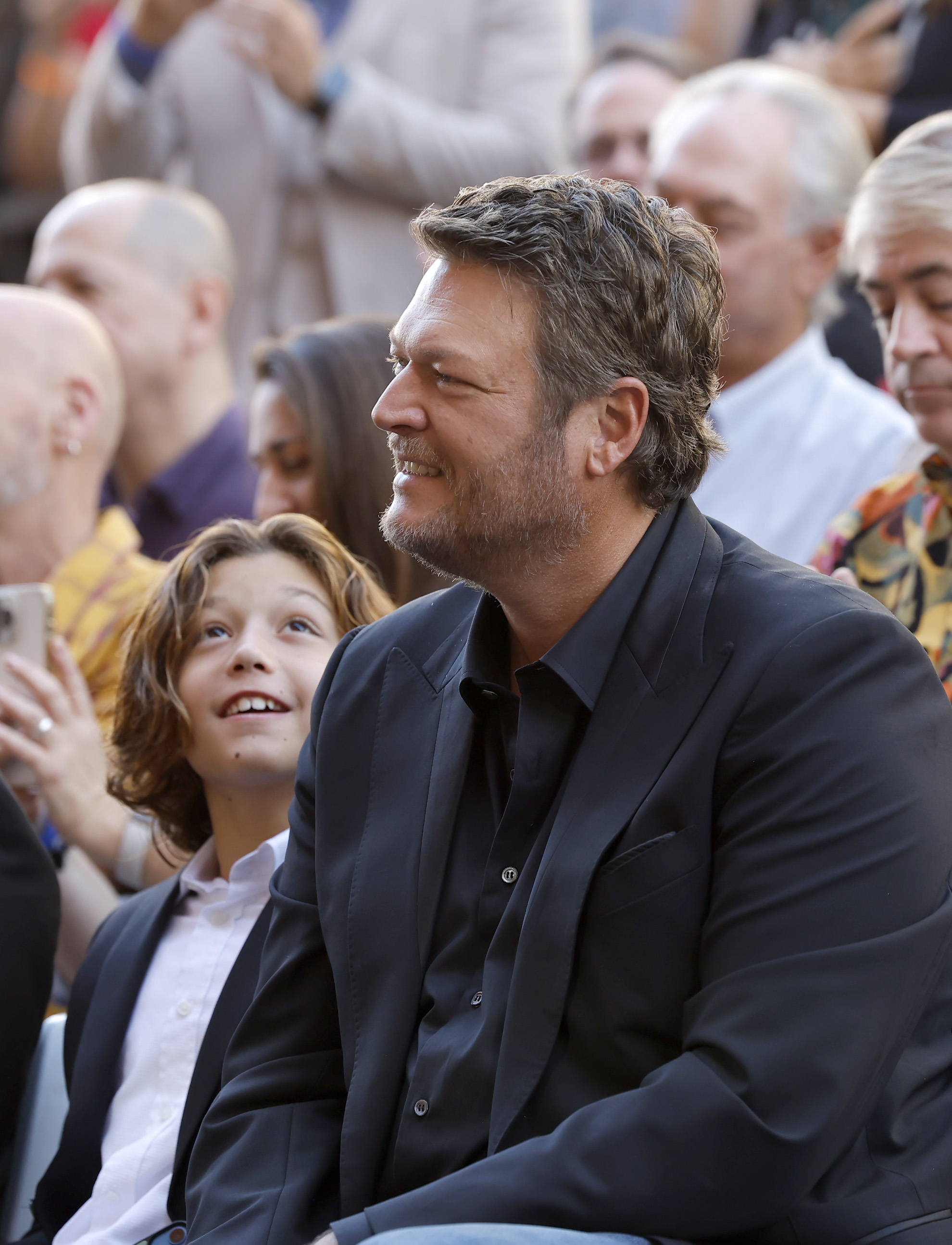 Apollo Rossdale and Blake Shelton attend the Hollywood Walk of Fame Star Ceremony Honoring Gwen Stefani in Hollywood, California, on October 19, 2023. | Source: Getty Images