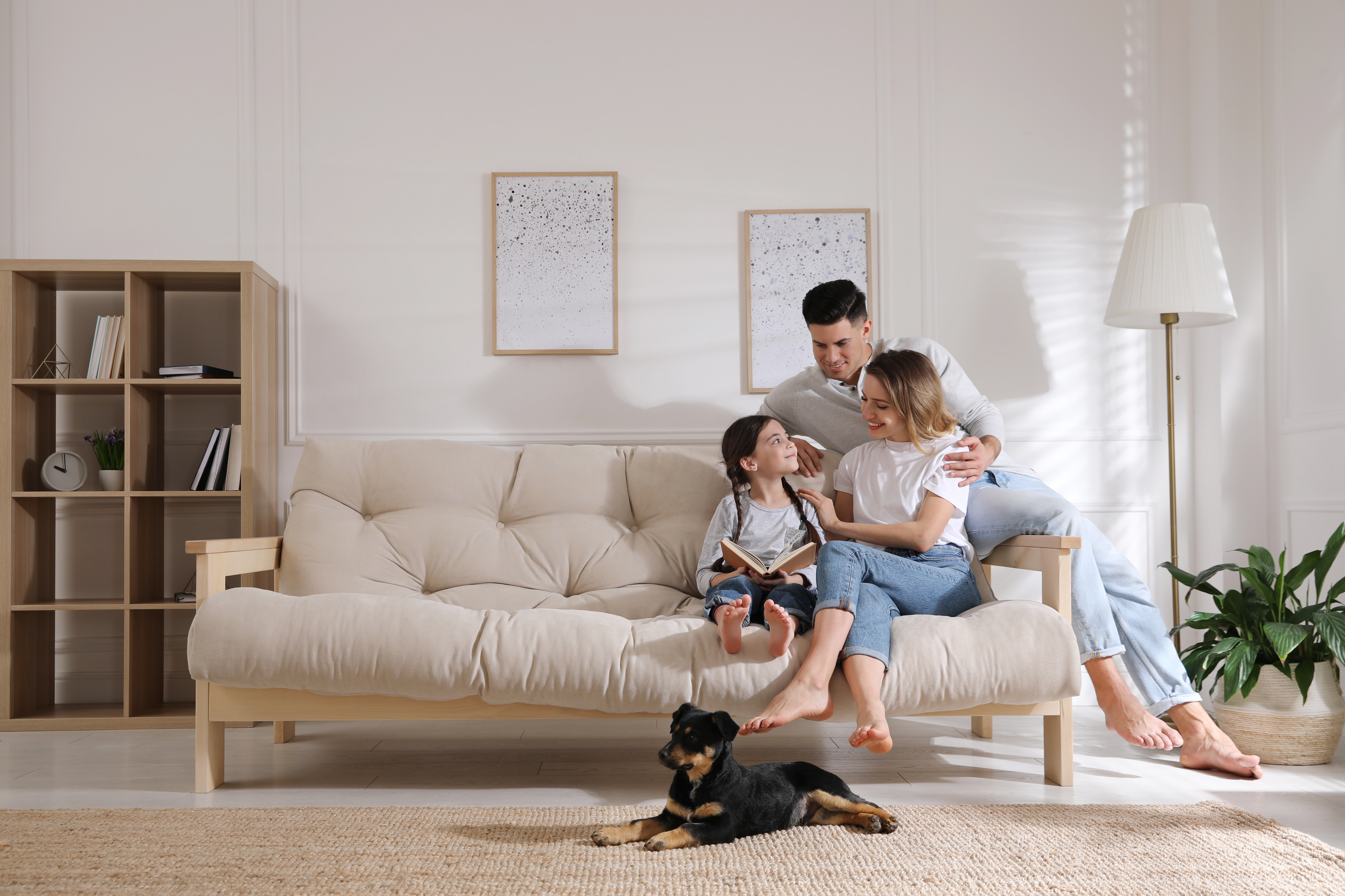 A family and their pet dog | Source: Shutterstock