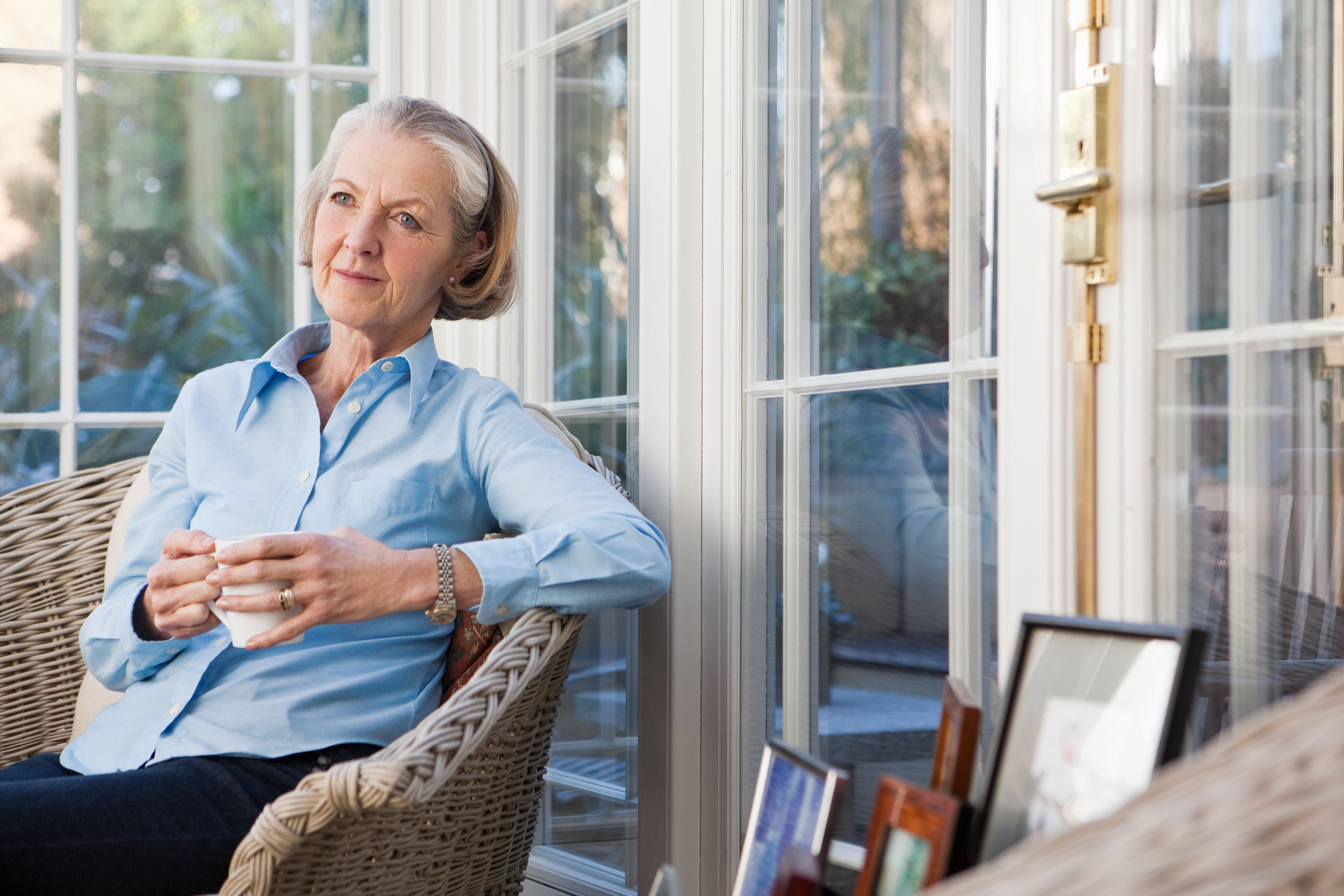 Senior woman relaxing with hot drink | Source: Getty Images
