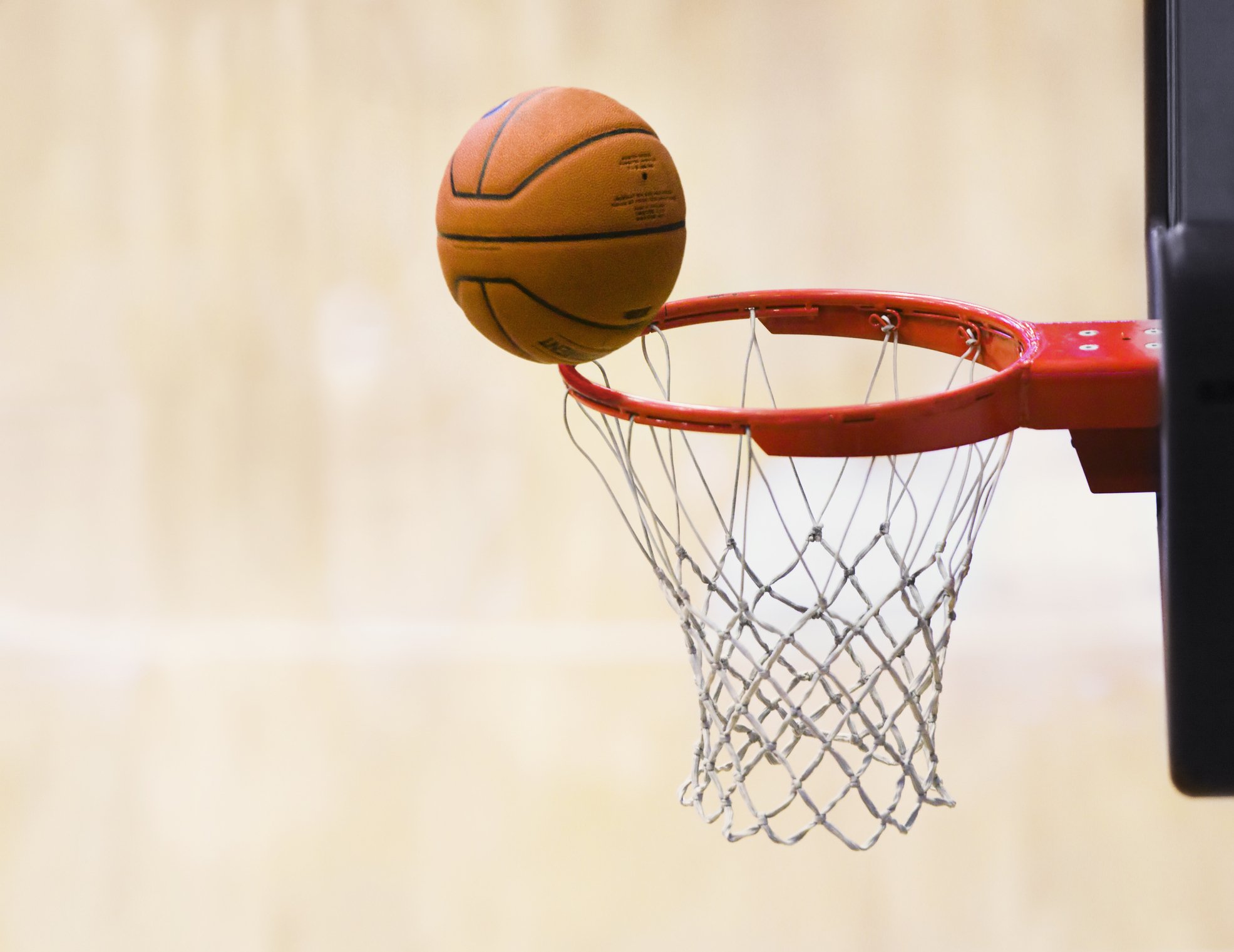 Basketball on rim of basket. | Photo: Getty Images