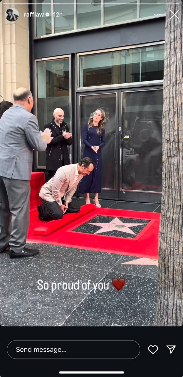 Jude Law can be seen kneeling beside his star on the Hollywood Walk of Fame, as seen in Raff Law's Instagram story | Source: Instagram/rafflaw