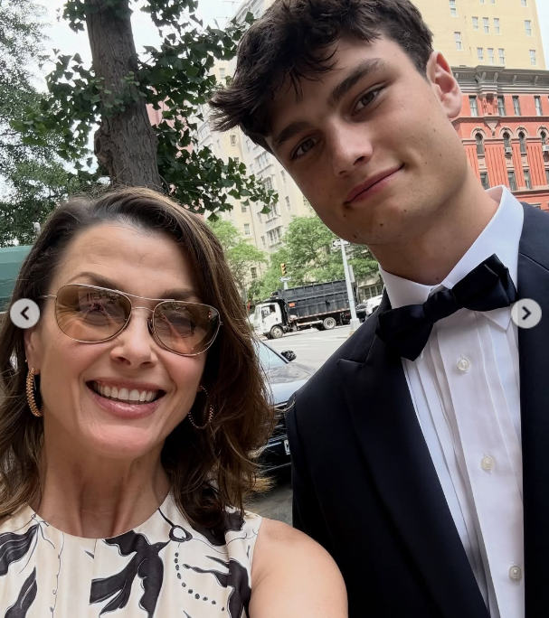 The actress shared her own photos, showing how handsome her son looked. In this image, Bridget Moynahan and Jack Brady posed on a street while dressed nicely on a carousel posted on June 14, 2026 | Source: Instagram/bridgetmoynahan