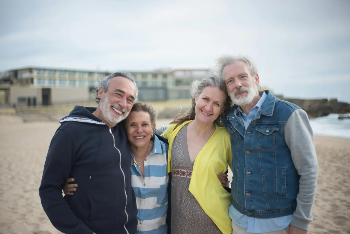 Two couples posing together by the beach | Source: Pexels