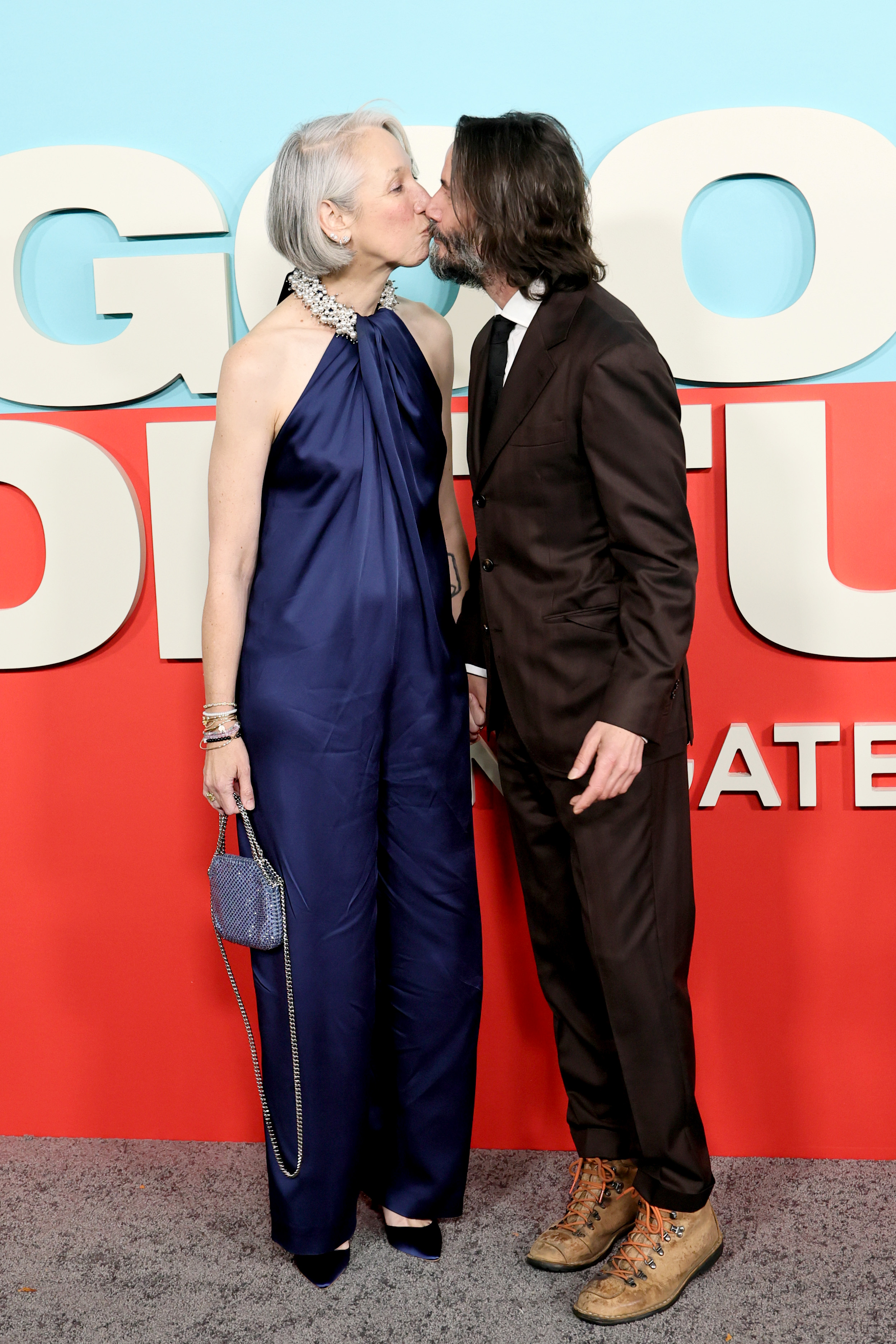 Alexandra Grant and Keanu Reeves sharing a tender moment at the movie screening. | Source: Getty Images