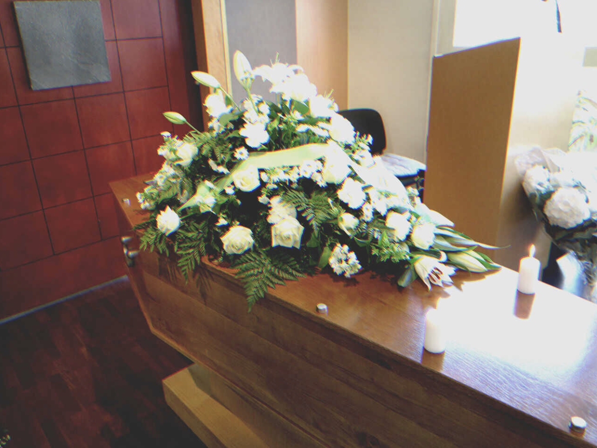 Flowers on the coffin | Source: Getty Images