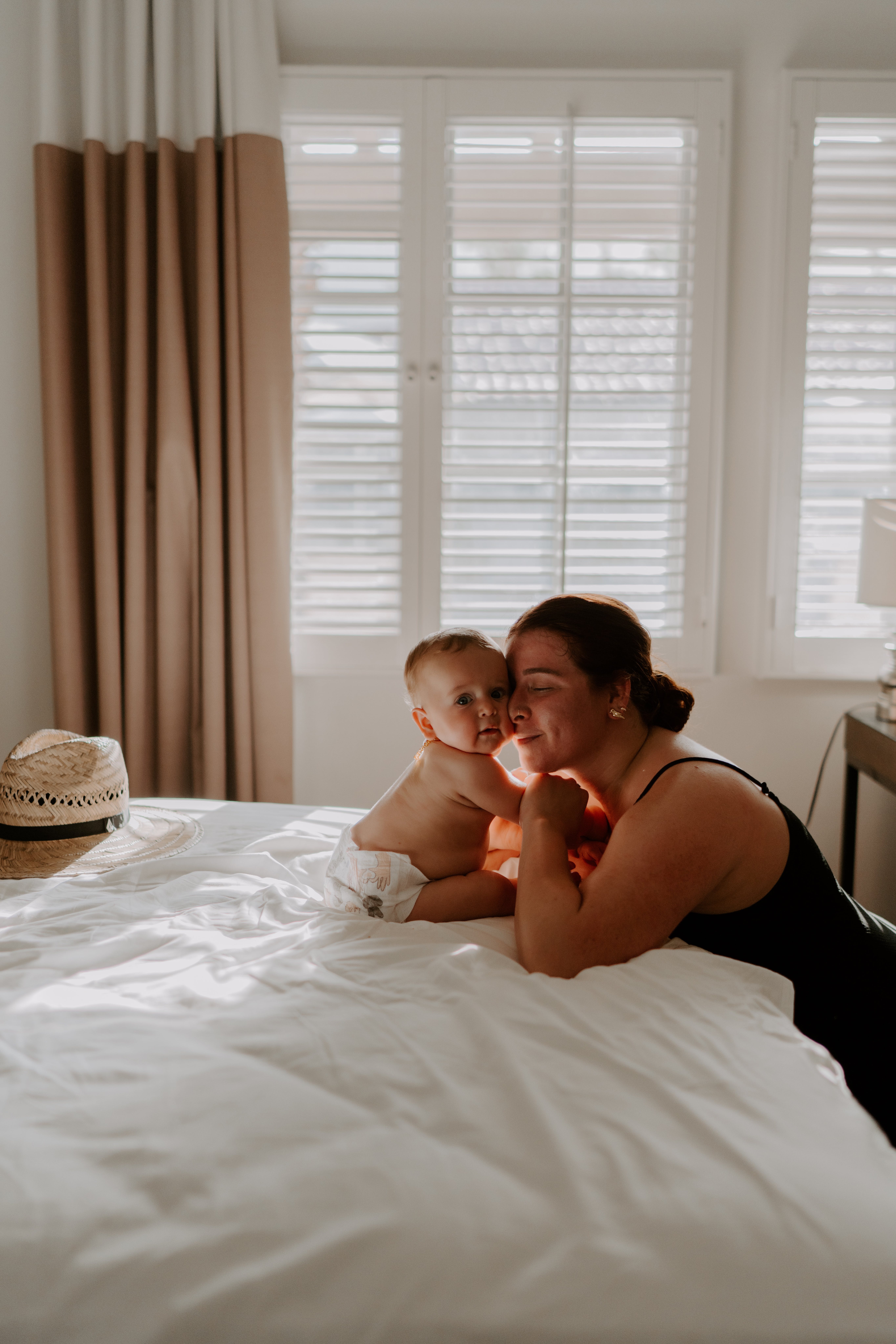A woman with a baby in bed | Source: Pexels