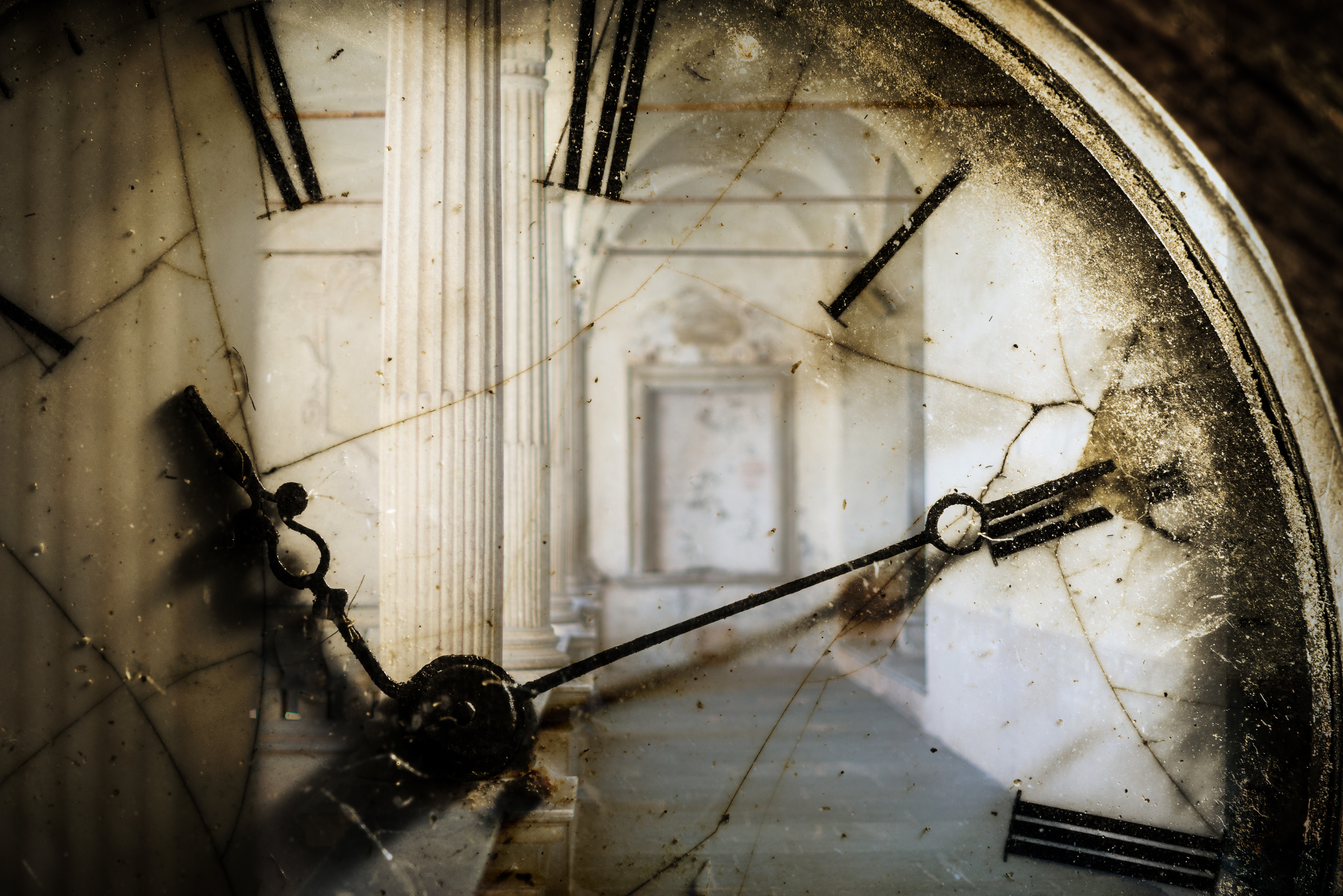 Double exposure of antique pocket watch and old architecture | Source: Getty Images
