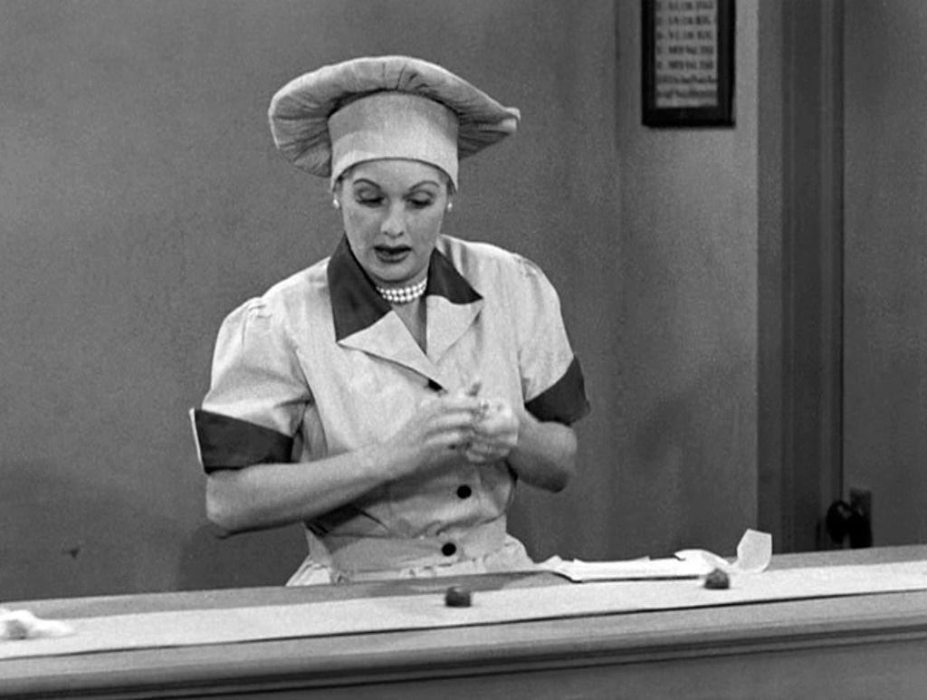 American comedienne and actress Lucille Ball as Lucy Ricardo, works at a candy factory conveyor belt in an episode of the television comedy 'I Love Lucy' entitled 'Job Switching' | Source: Getty Images