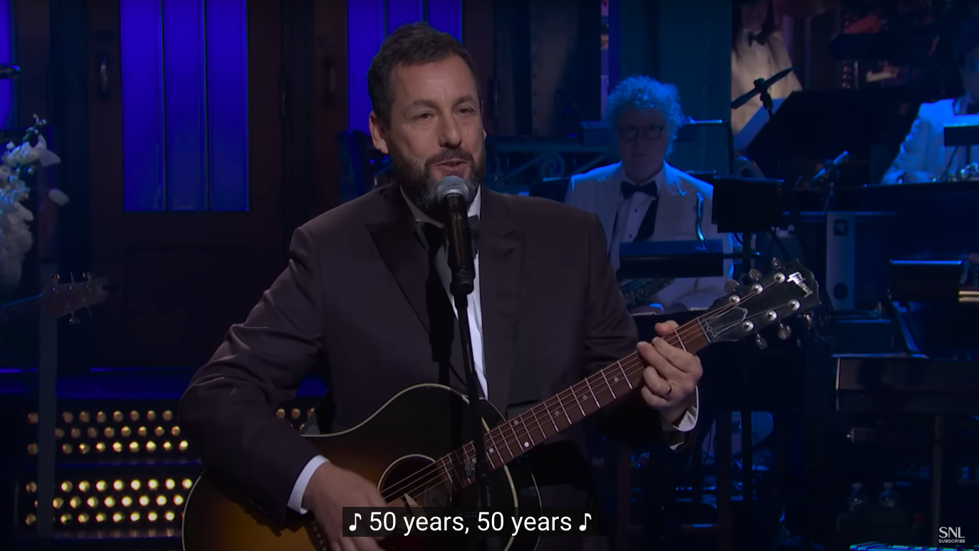 Adam Sandler during his musical tribute on "SNL50: The Anniversary Special." | Source: YouTube/Saturday Night Live