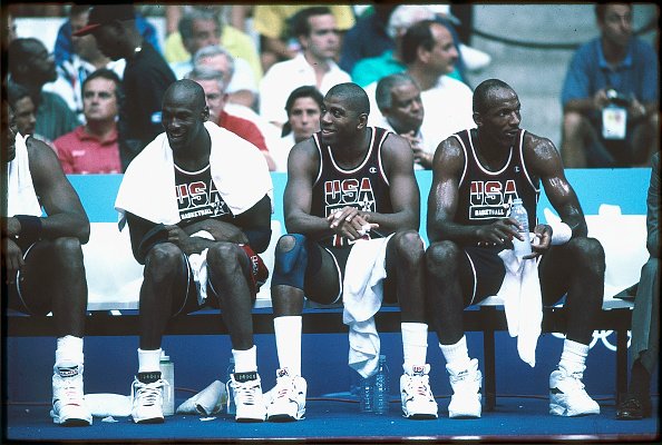  Michael Jordan (L), Magic Johnson (M) and Clyde Drexler (R) of Team USA, the Dream Team, sit on the bench during the men's basketball competition at the 1992 Summer Olympics in Barcelona, Spain | Source: Getty Images