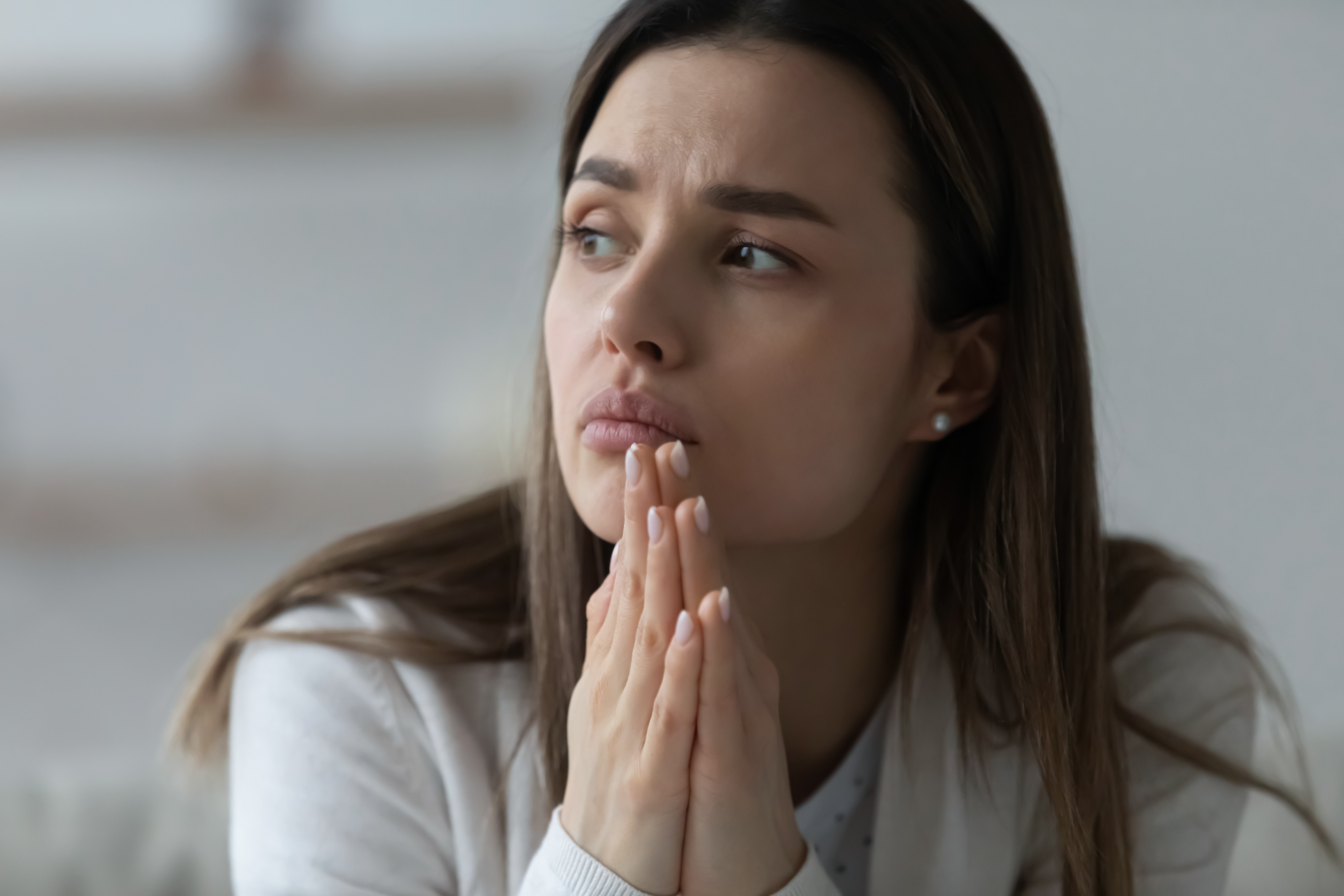 A woman thinking | Source: Shutterstock