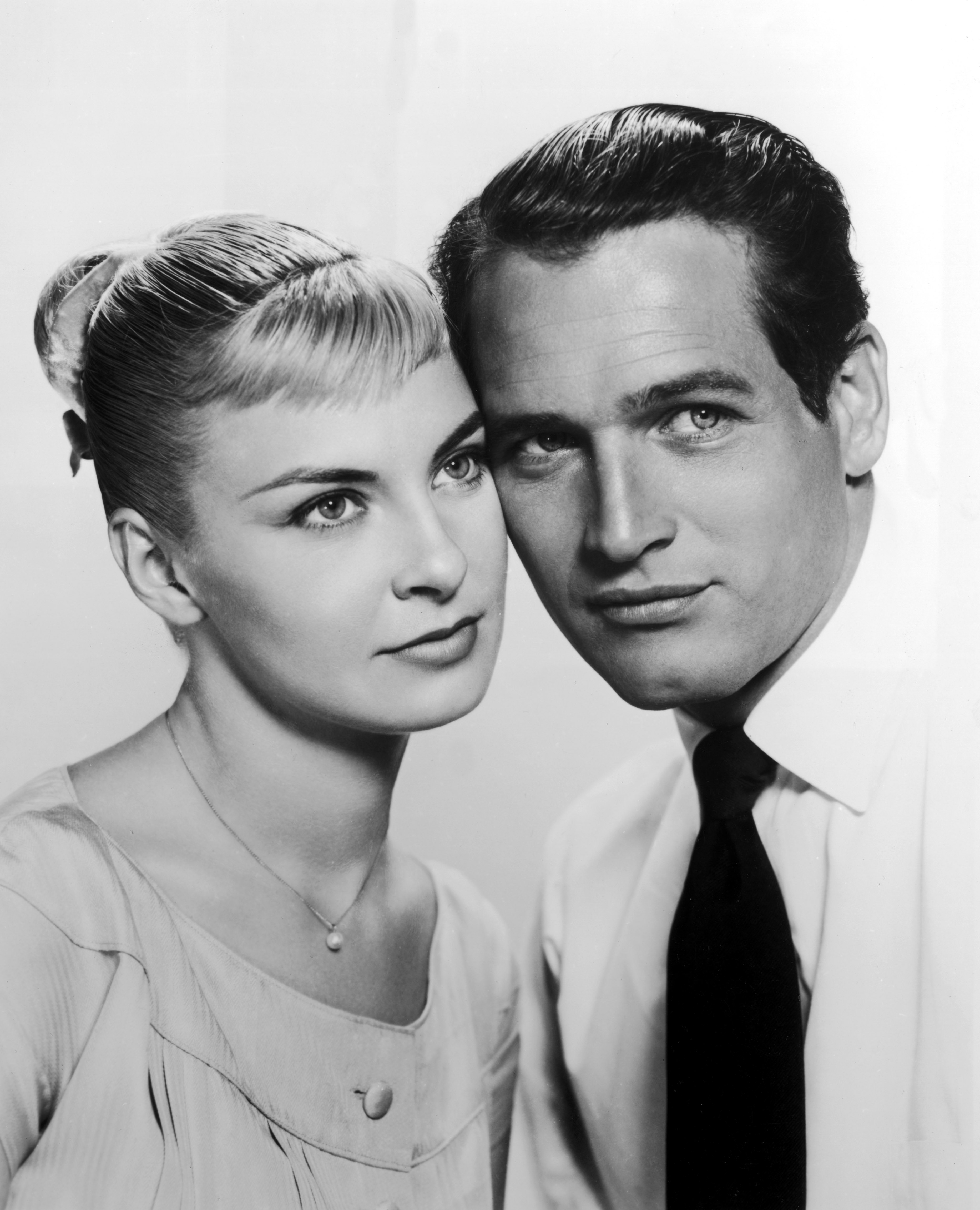 Joanne Woodward and Paul Newman posing cheek to cheek for the film, "The Long Hot Summer," directed in 1958 | Source: Getty Images