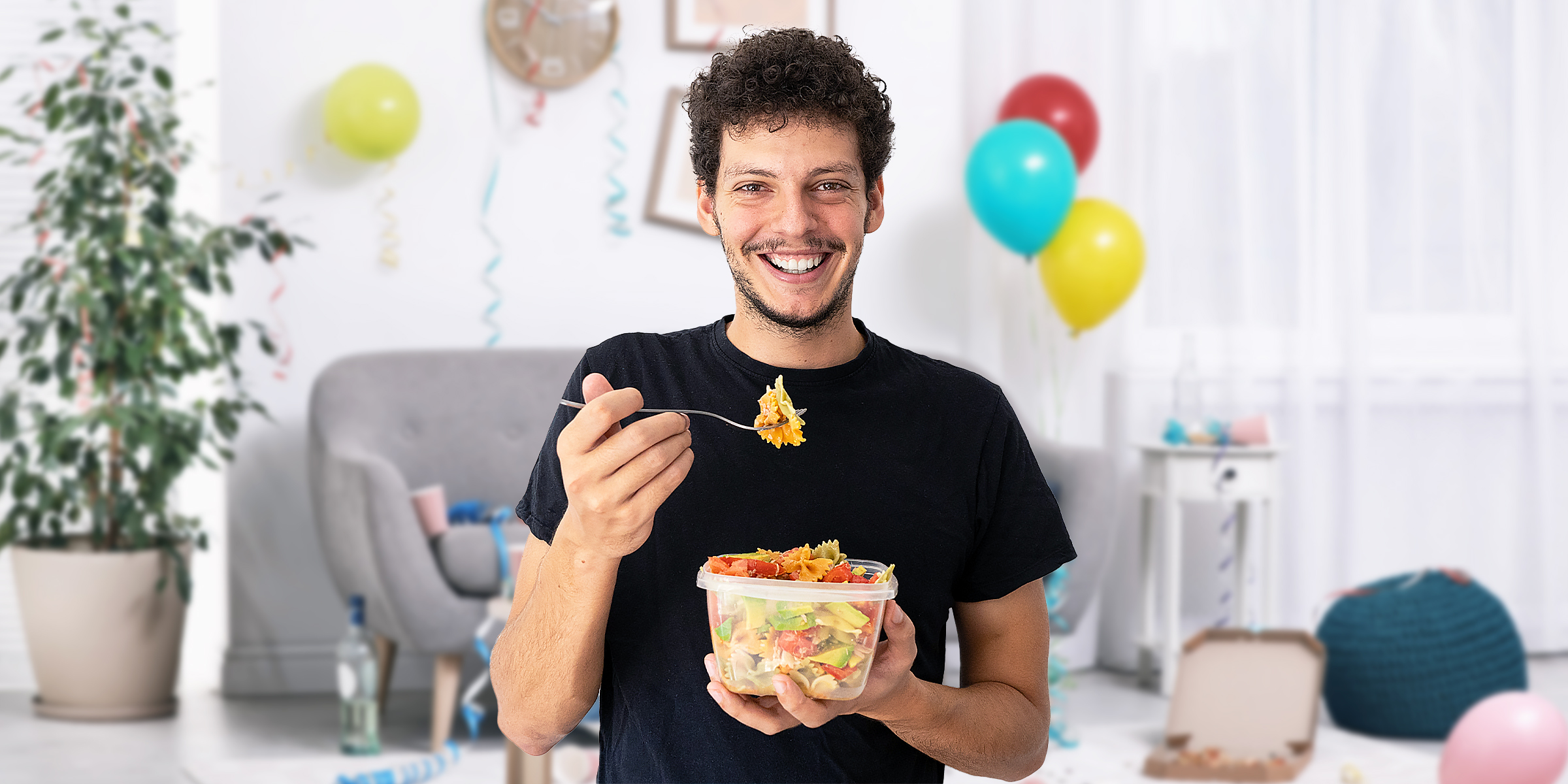 A man eating from a Tupperware | Source: Shutterstock