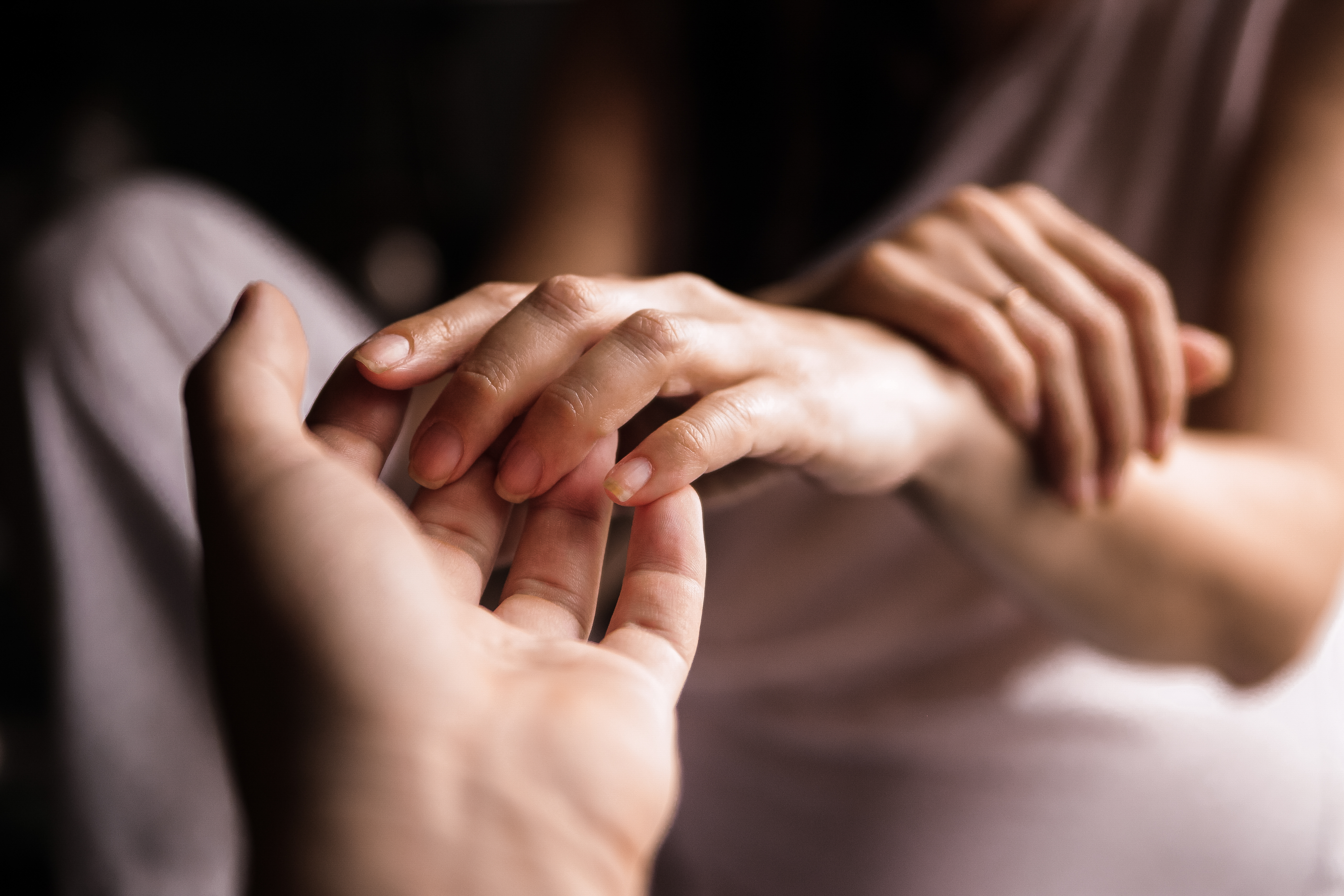 Woman and man holding hands | Source: Shutterstock