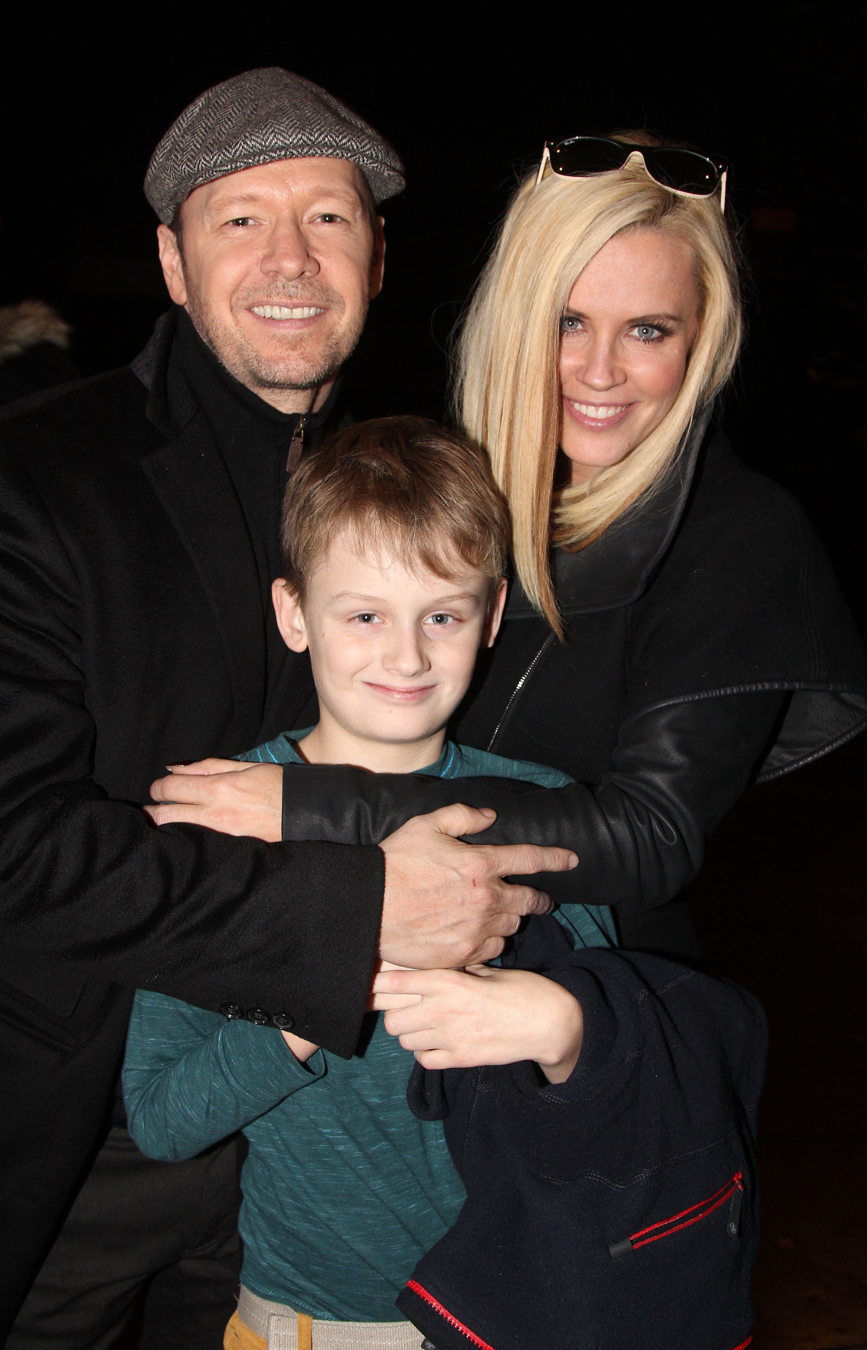 Donnie Wahlberg, Evan Asher, and his mother Jenny McCarthy pose backstage at the musical "Cinderella" The Broadway Theater on November 16, 2014 in New York City | Source: Getty Images