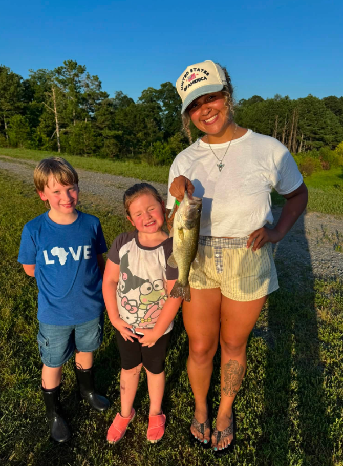 Jordan Thompson smiles beside her younger sister, Emersyn "Emmy" Bridgers, during a fishing outing. In her tribute, Jordan said Emmy was her "best girl," adding that she took the 6-year-old everywhere and that "she wanted to be just like her big sissy." | Source: Facebook/Jordan Thompson