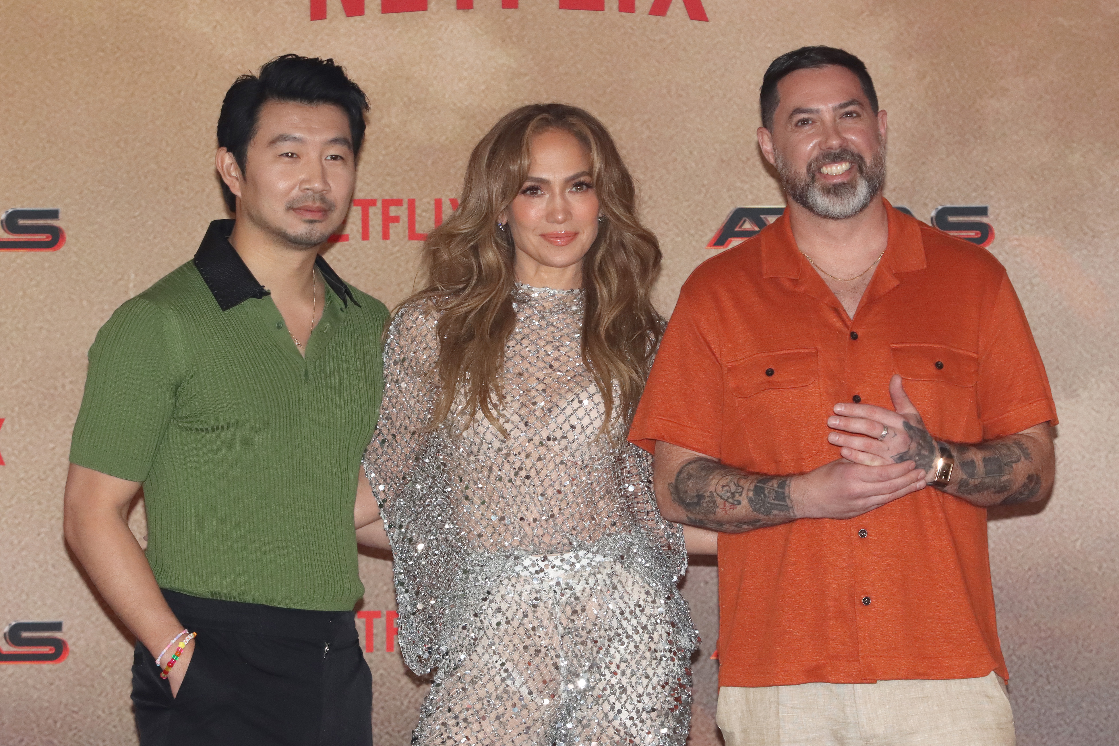 Simu Liu, Jennifer Lopez and filmmaker Brad Peyton pose during a photocall at Hotel St. Regis on May 22, 2024, in Mexico City, Mexico. | Source: Getty Images