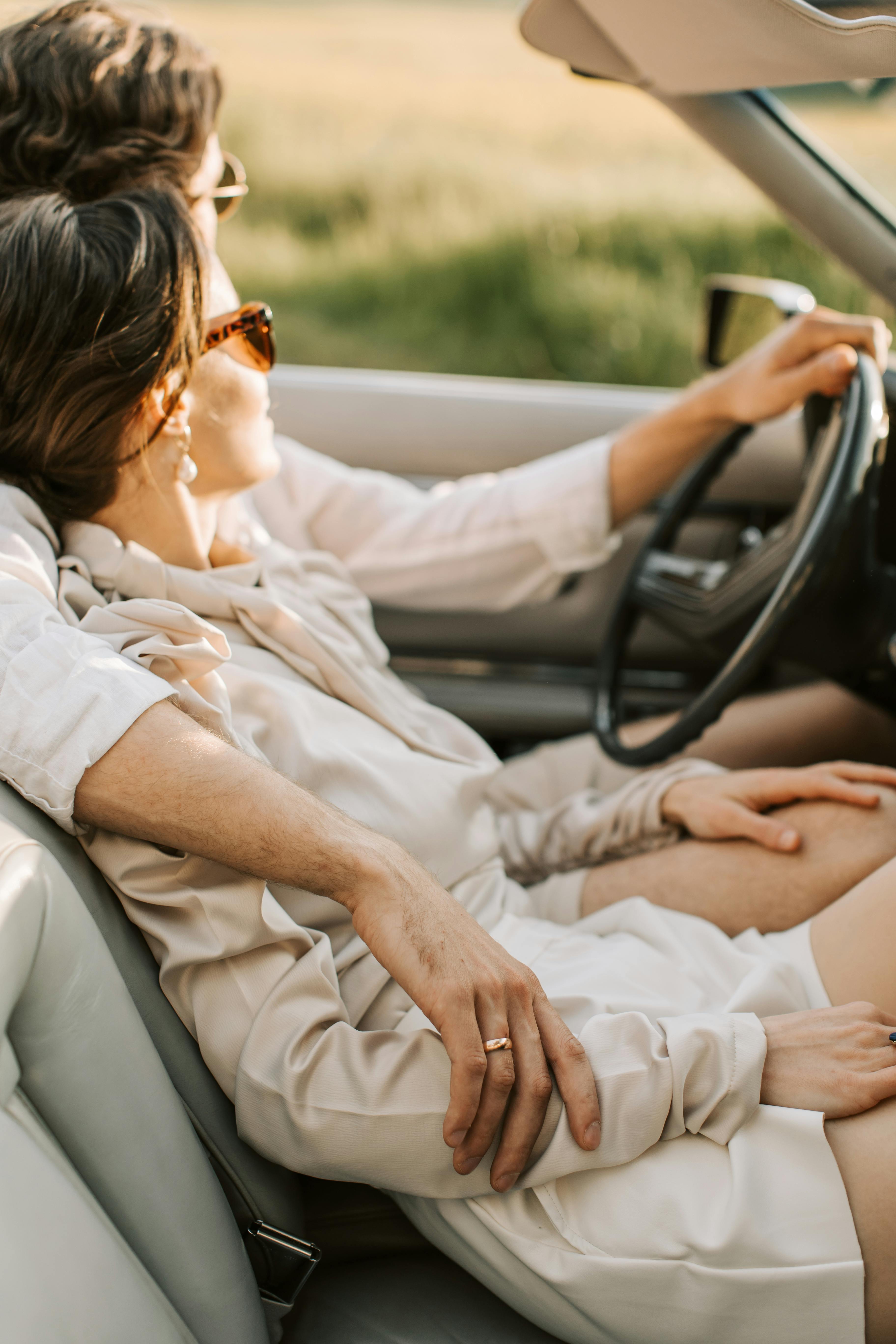 A couple driving in a luxury car | Source: Pexels
