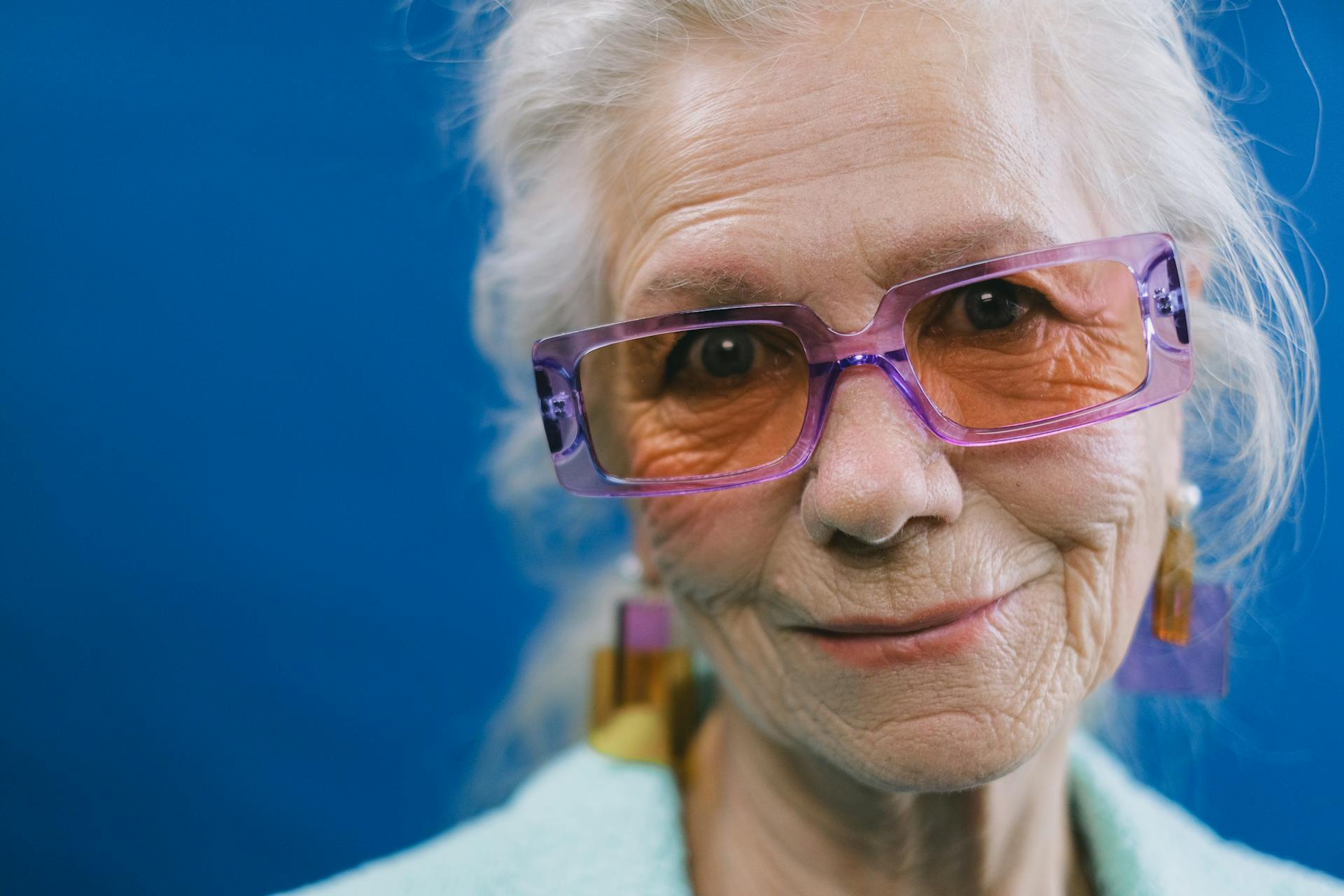 A cheerful older lady smiling at someone | Source: Pexels