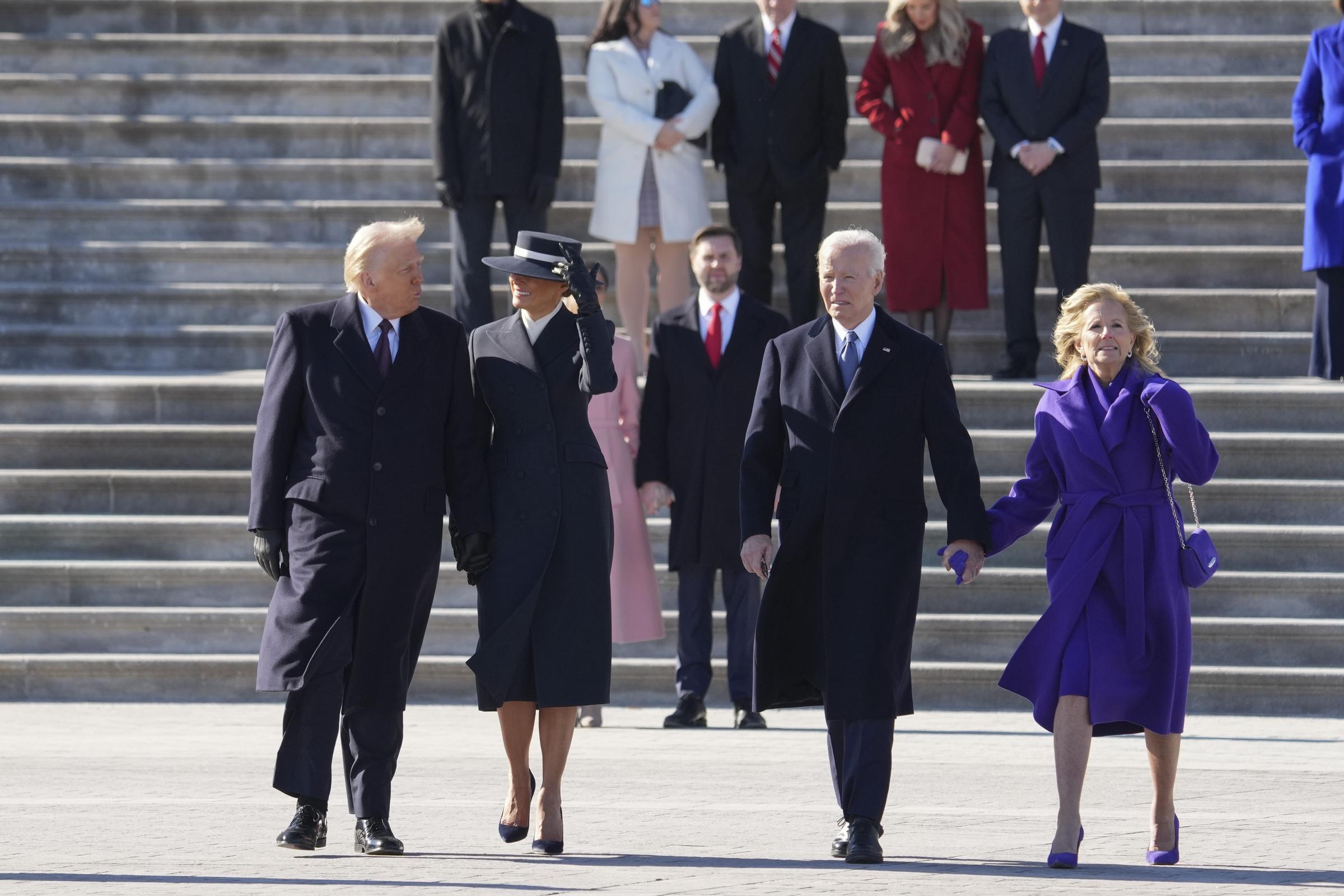 Donald Trump and Melania Trump accompany Joe Biden and Jill Biden to a U.S. Marine helicopter as the Bidens depart the U.S. Capitol | Source: Getty Images