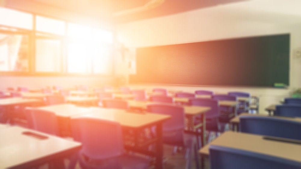Classroom with sunshine streaming in | Shutterstock