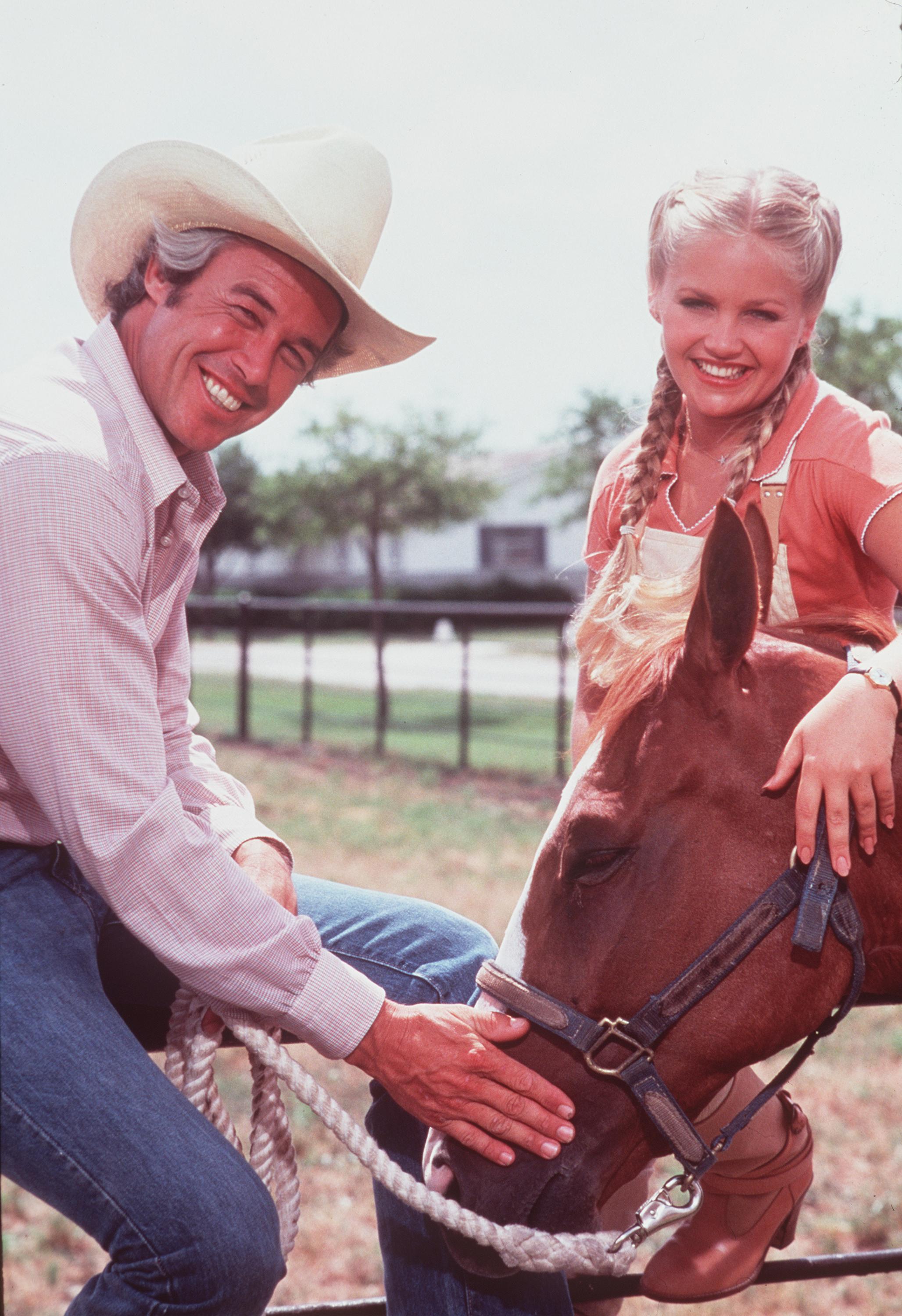 Charlene Tilton (as Lucy Ewing) with her co-star on the set of the hit television soap opera, "Dallas" | Photo: GettyImages