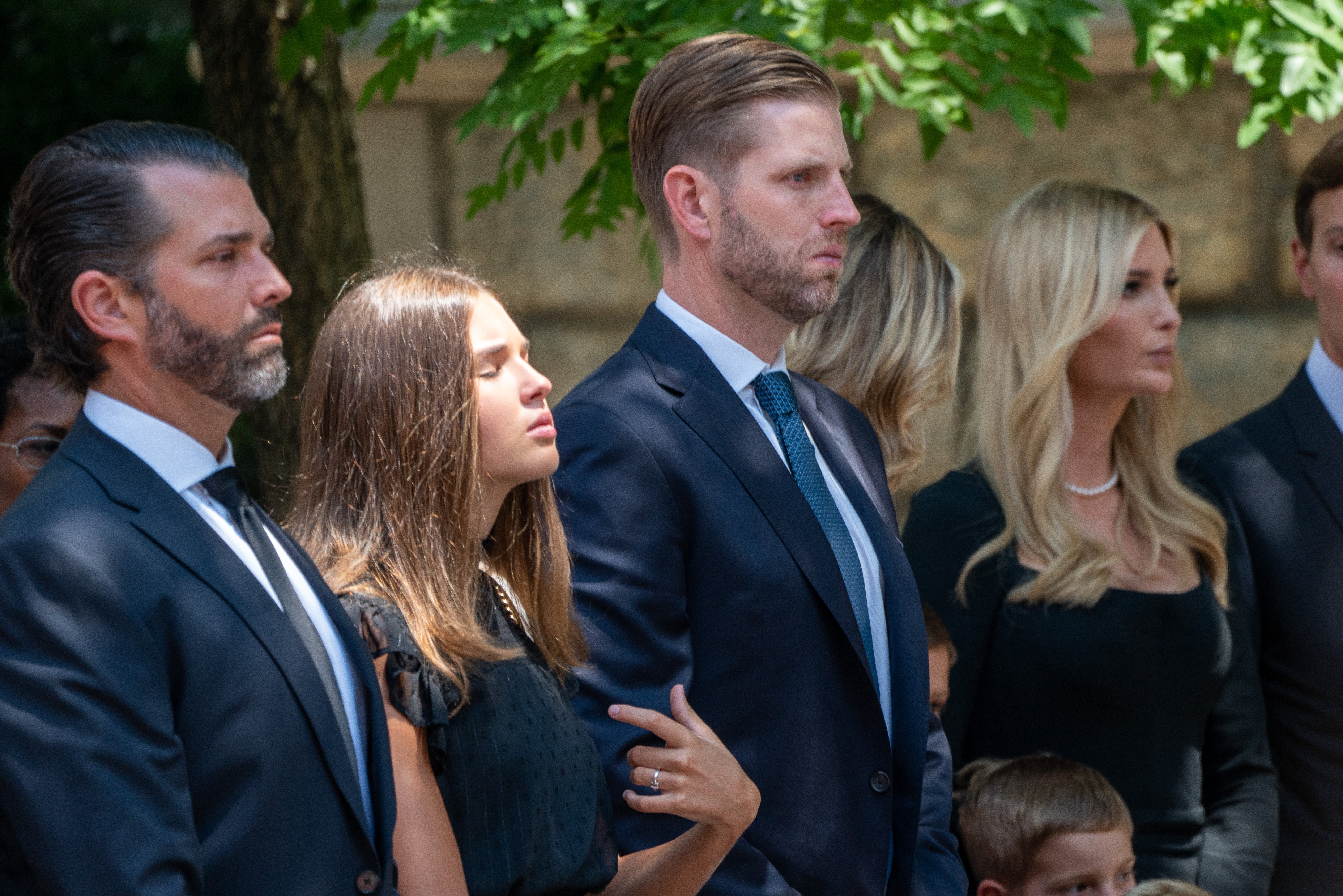 Donald Trump Jr., (L) Eric Trump, and Ivanka Trump arriving at the funeral of their mother Ivana Trump on July 20, 2022 in New York.┃Source: Getty Images